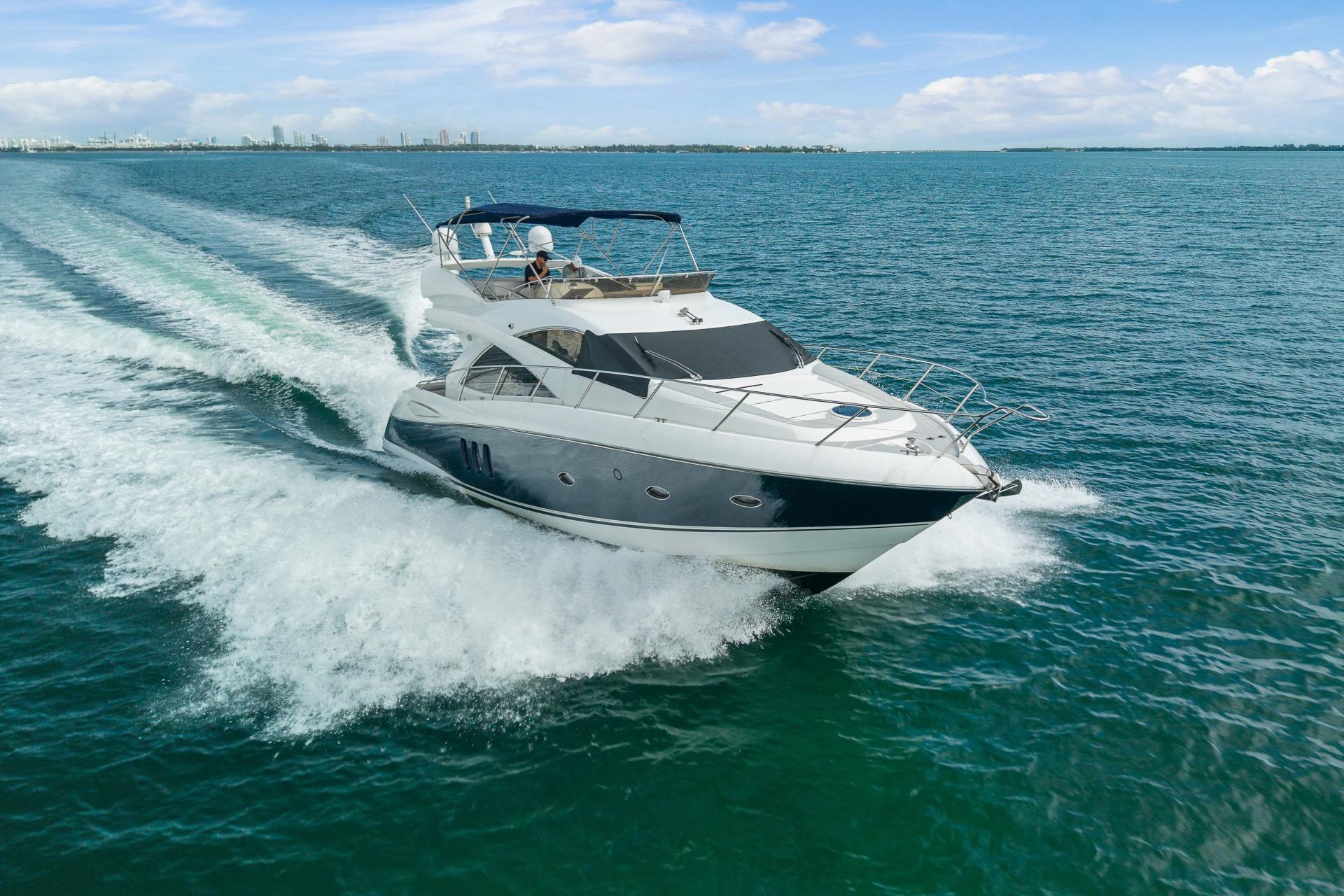 2006 Sunseeker Manhattan 50 yacht cruising on open water under a clear sky.