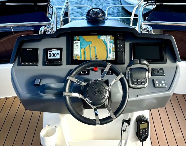 Helm of 2022 Aquila 44 yacht with navigation system and controls.
