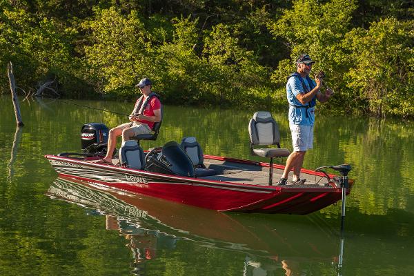 Manufacturer Provided Image: Two people fishing on a 2021 Lowe Stinger 175C boat in a serene lake.