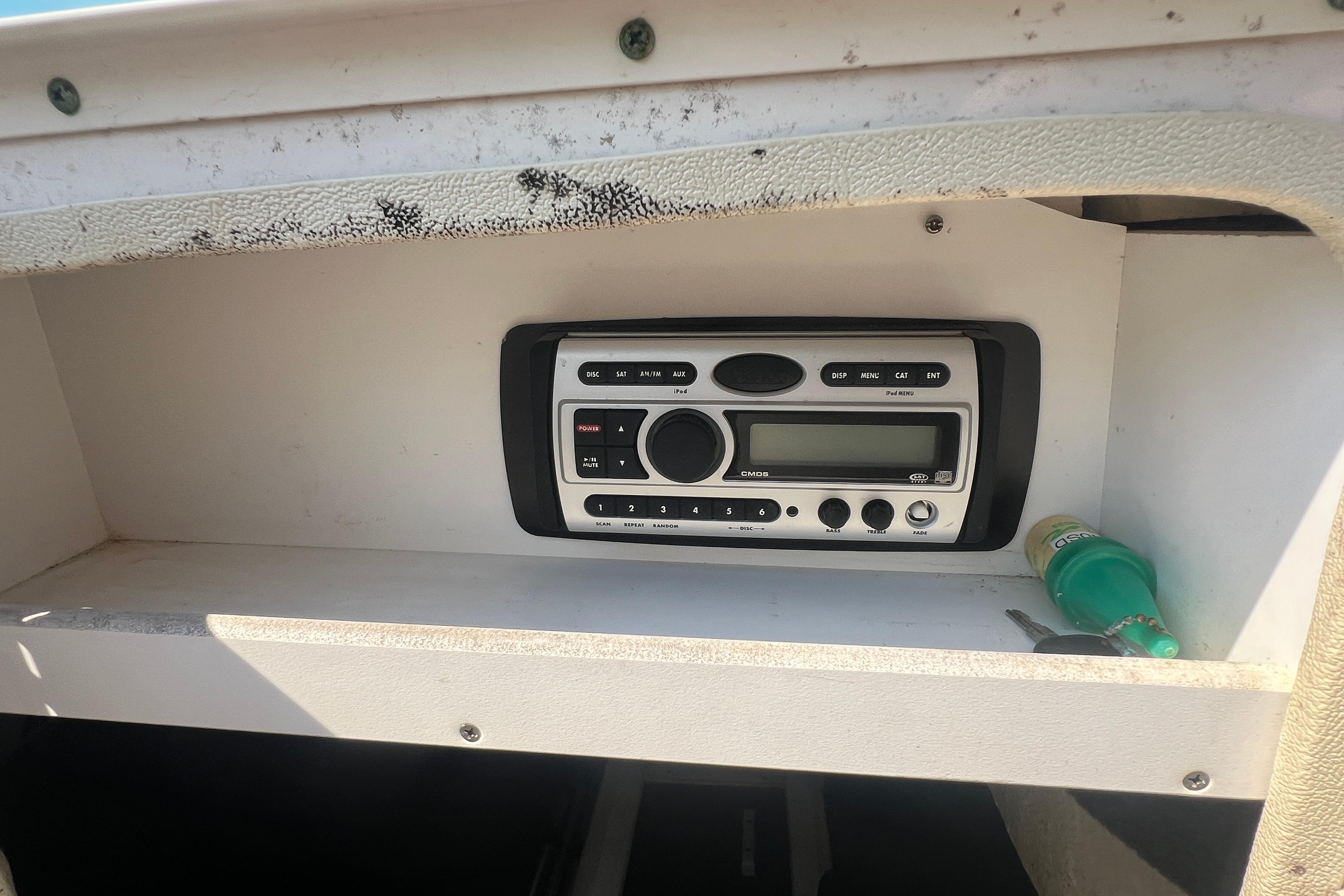 Boat stereo system in a 2005 Sea Ray 240 Sundeck compartment.
