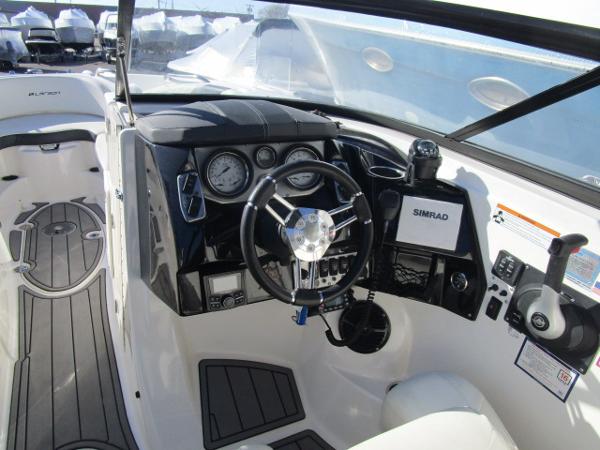 2017 Larson 292 LXI boat interior with steering wheel and dashboard controls.