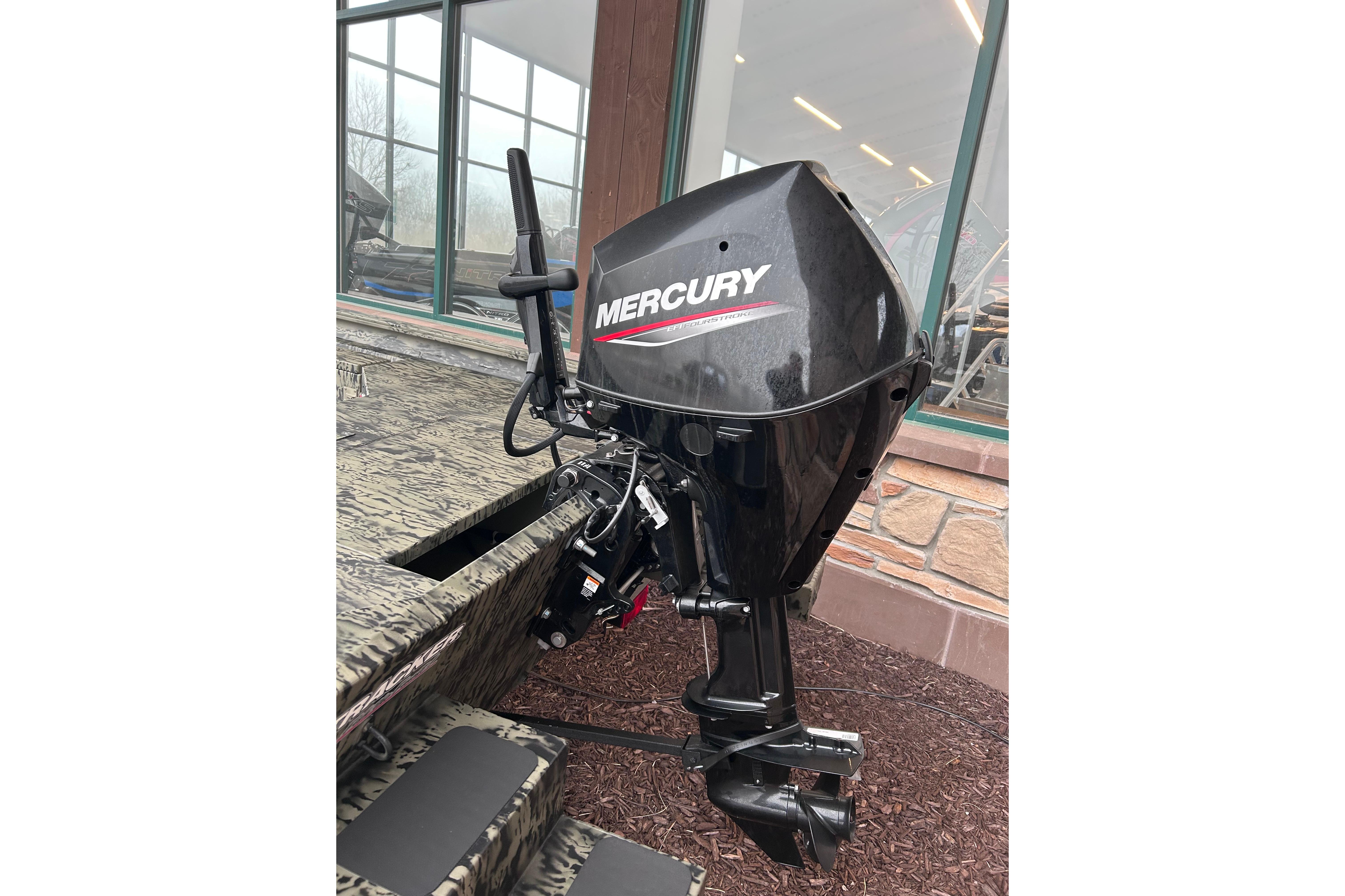 2026 Tracker Grizzly 1654 T Sportsman with Mercury outboard motor, camo design.