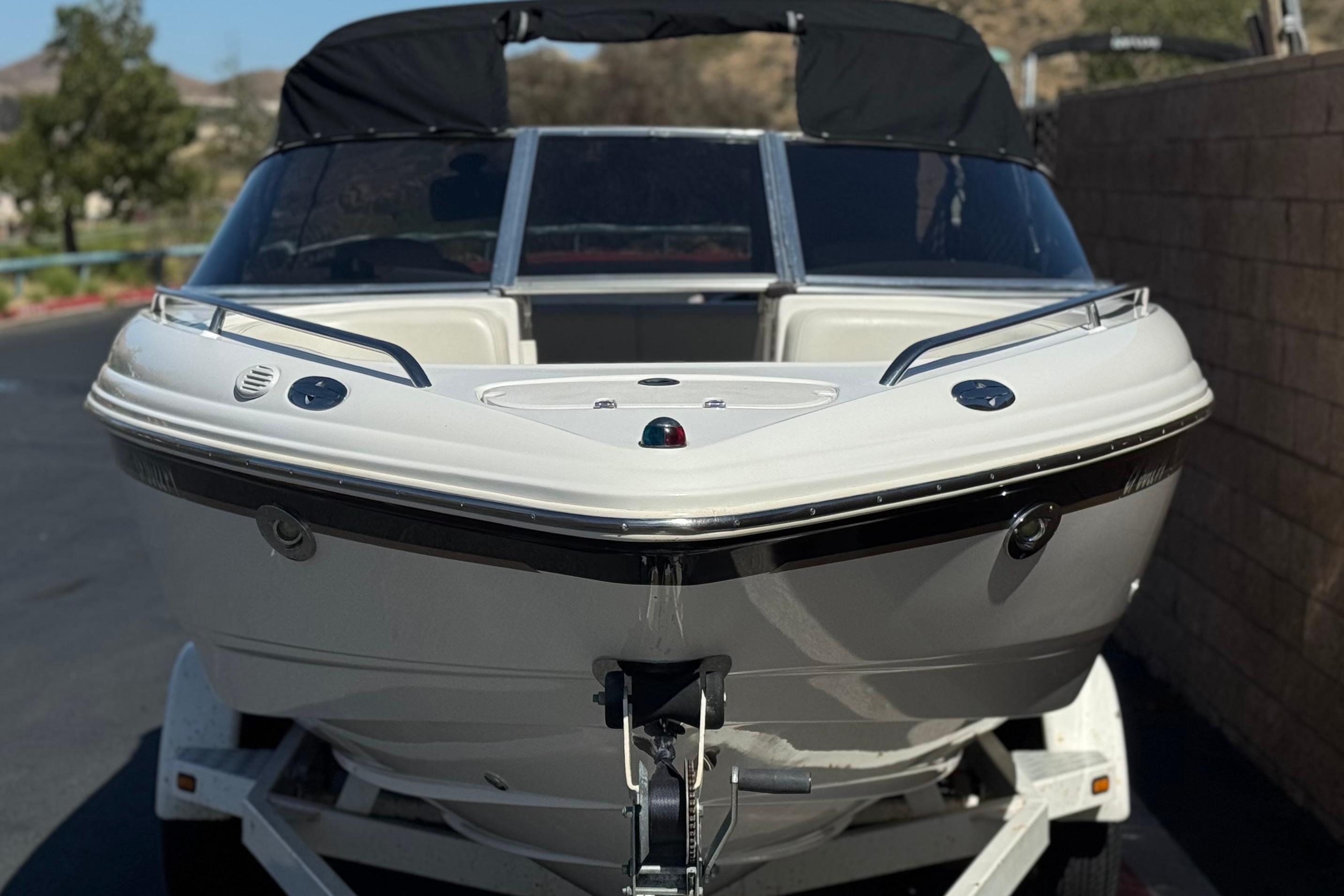 2002 Chaparral 186 SSi boat on trailer, front view, outdoors.