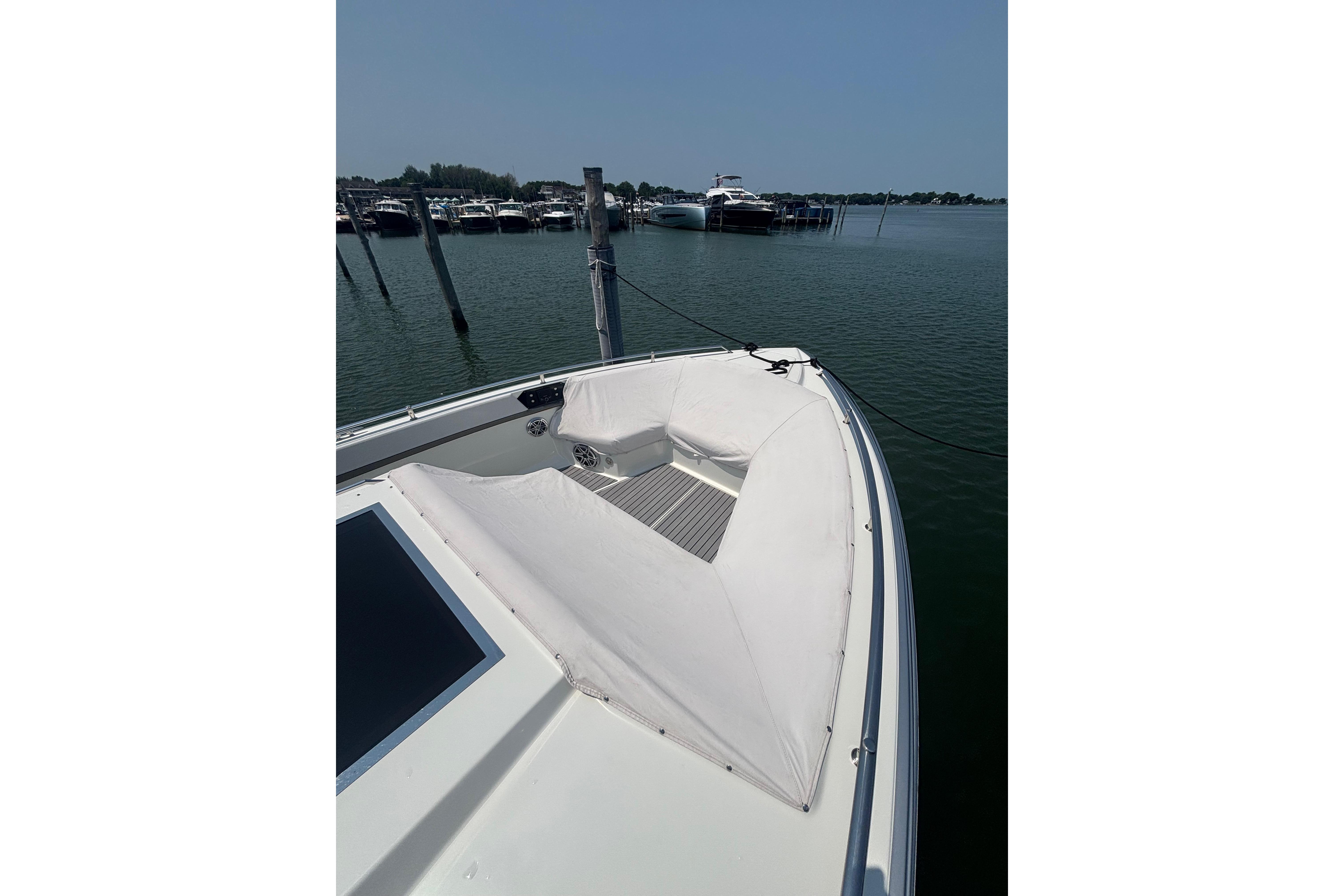 2019 Formula 430 Super Sport Crossover boat docked in a marina, showcasing sleek design.