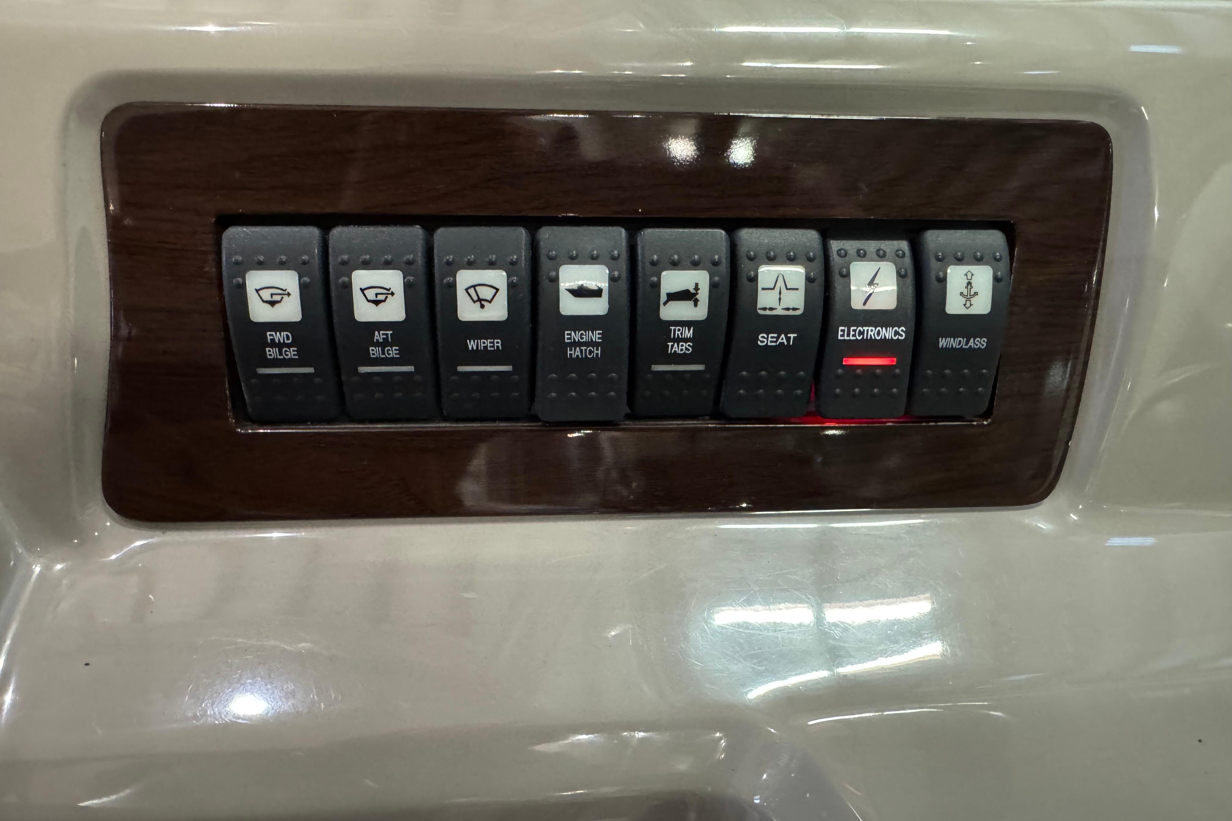 Control panel of a 2015 Chaparral 330 Signature boat with labeled switches.
