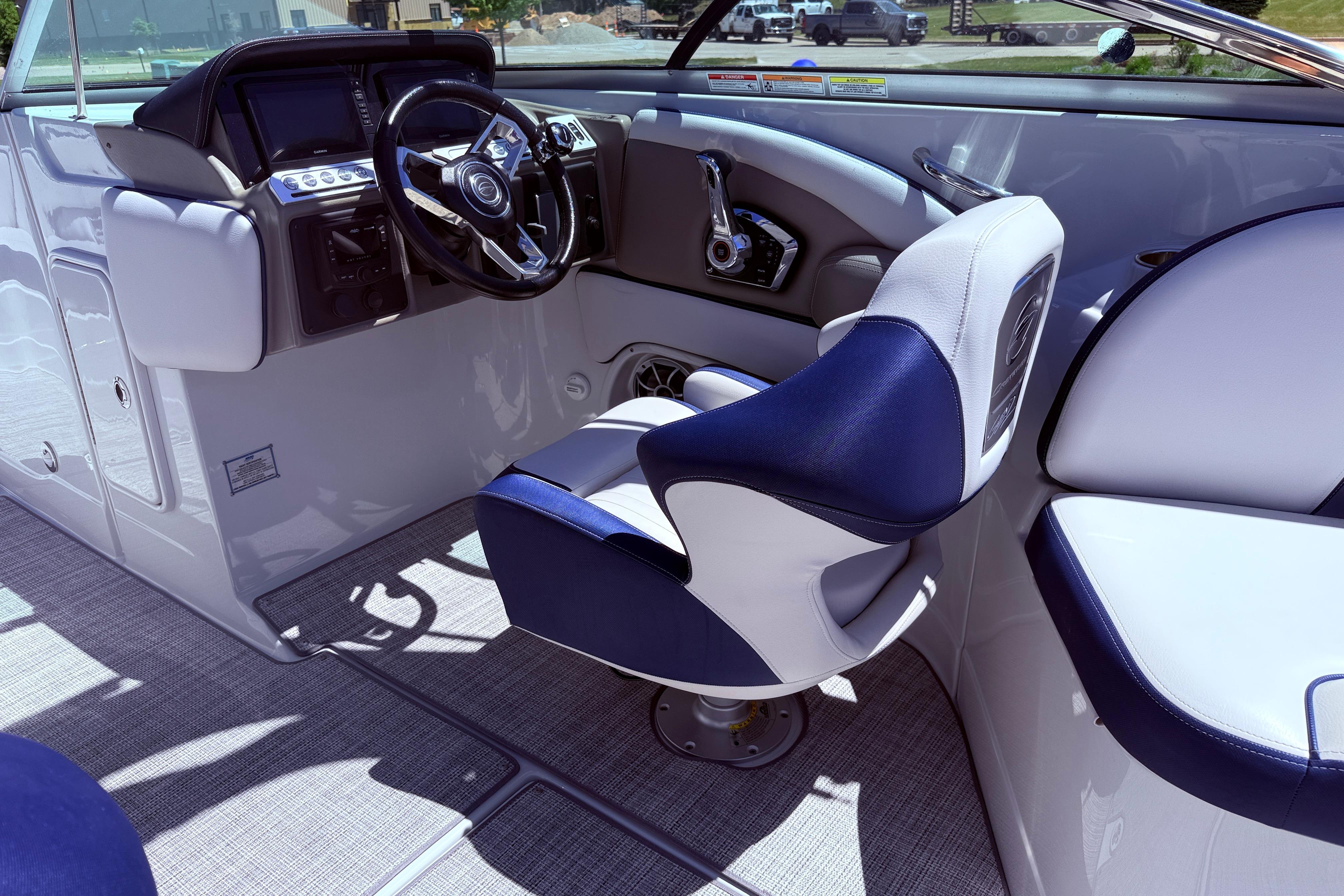 2025 Crownline 290 XSS boat interior with modern steering and seating.