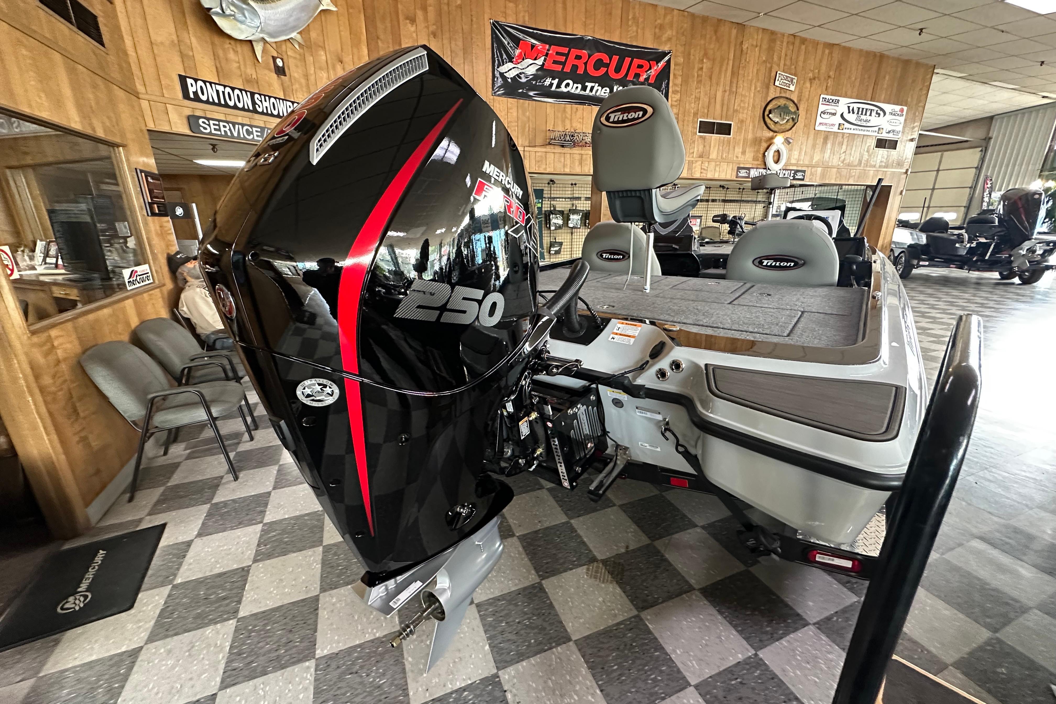 2024 Triton 20XP Patriot boat with Mercury 250 engine in showroom.