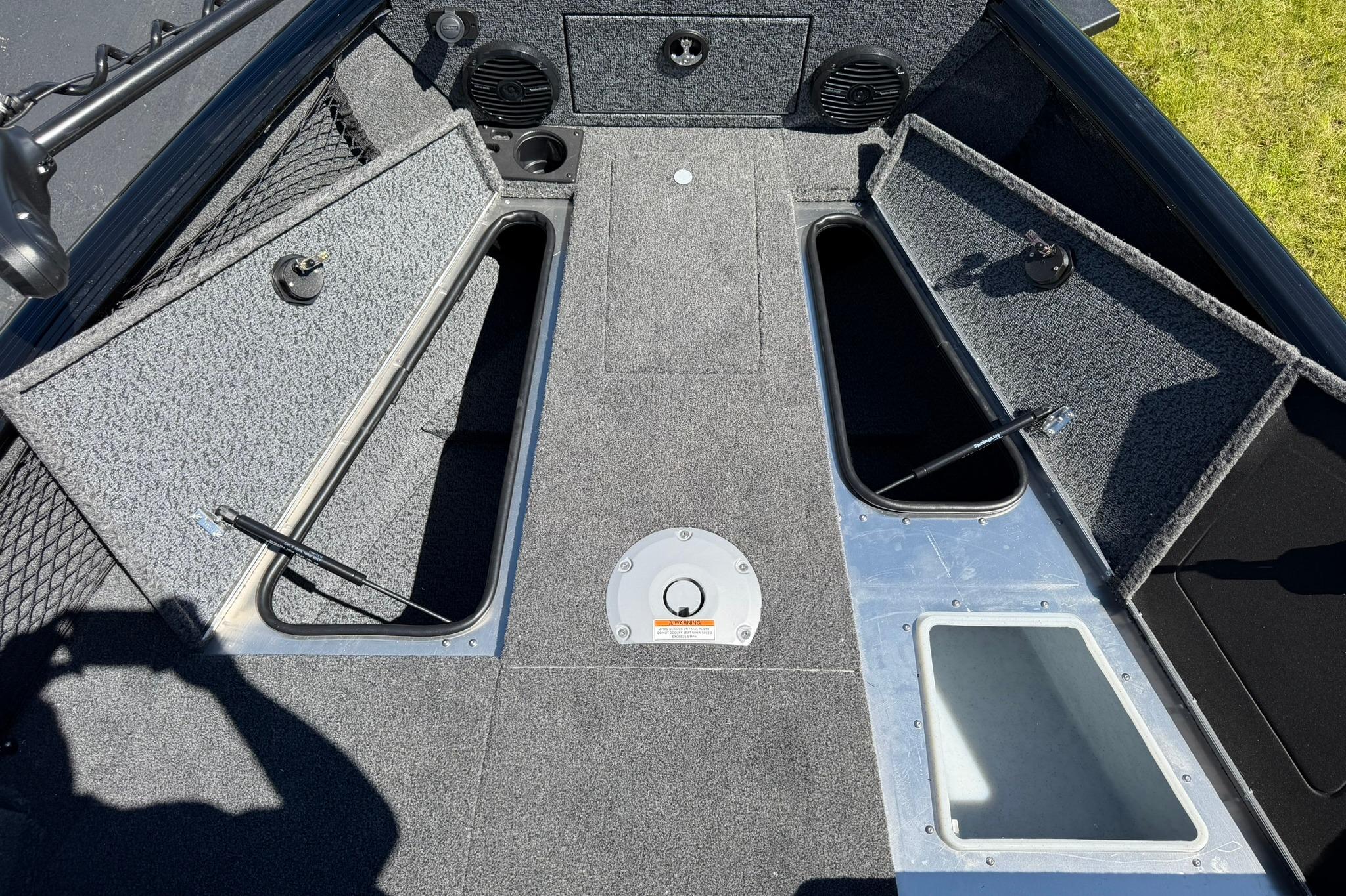 2027 Lund 1775 Impact XS Sport boat interior with open storage compartments.