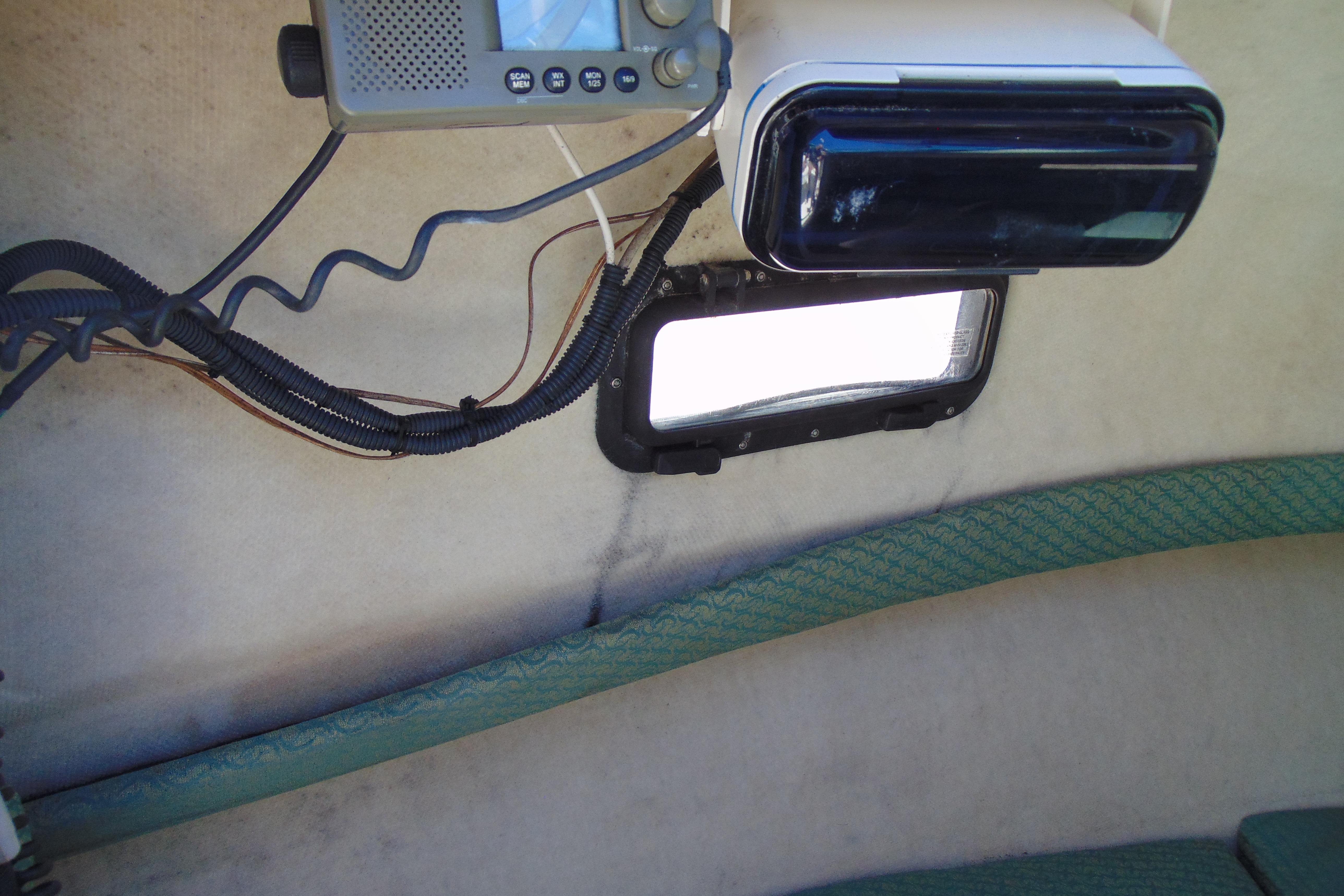 Interior of a 2002 Trophy Walkaround boat showing electronic equipment and wiring.