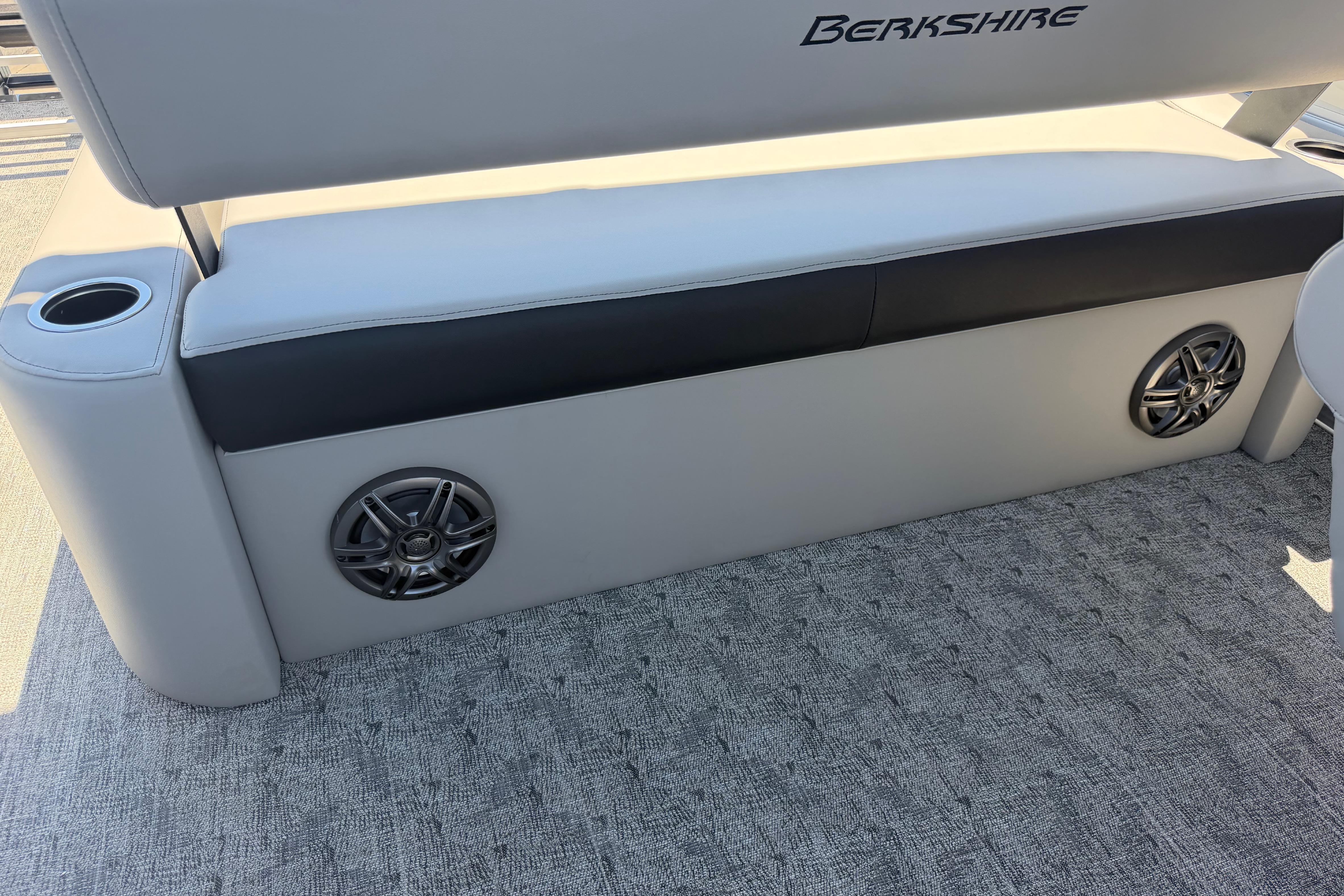 2026 Berkshire LE 24' Ultra Lounger with speakers and cup holder, showcasing luxury seating.
