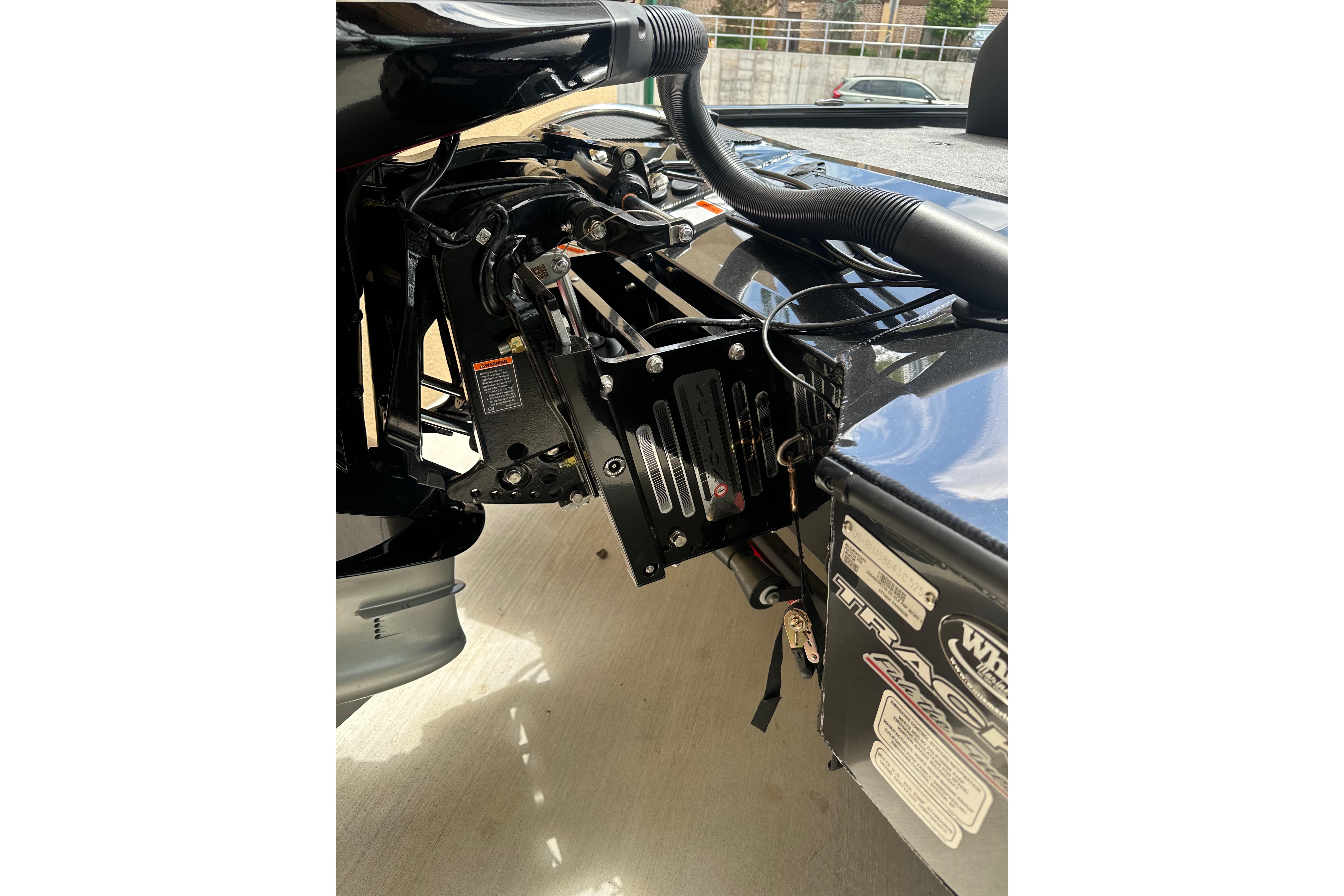 2025 Tracker Savage 215 boat engine compartment with detailed mechanical components.