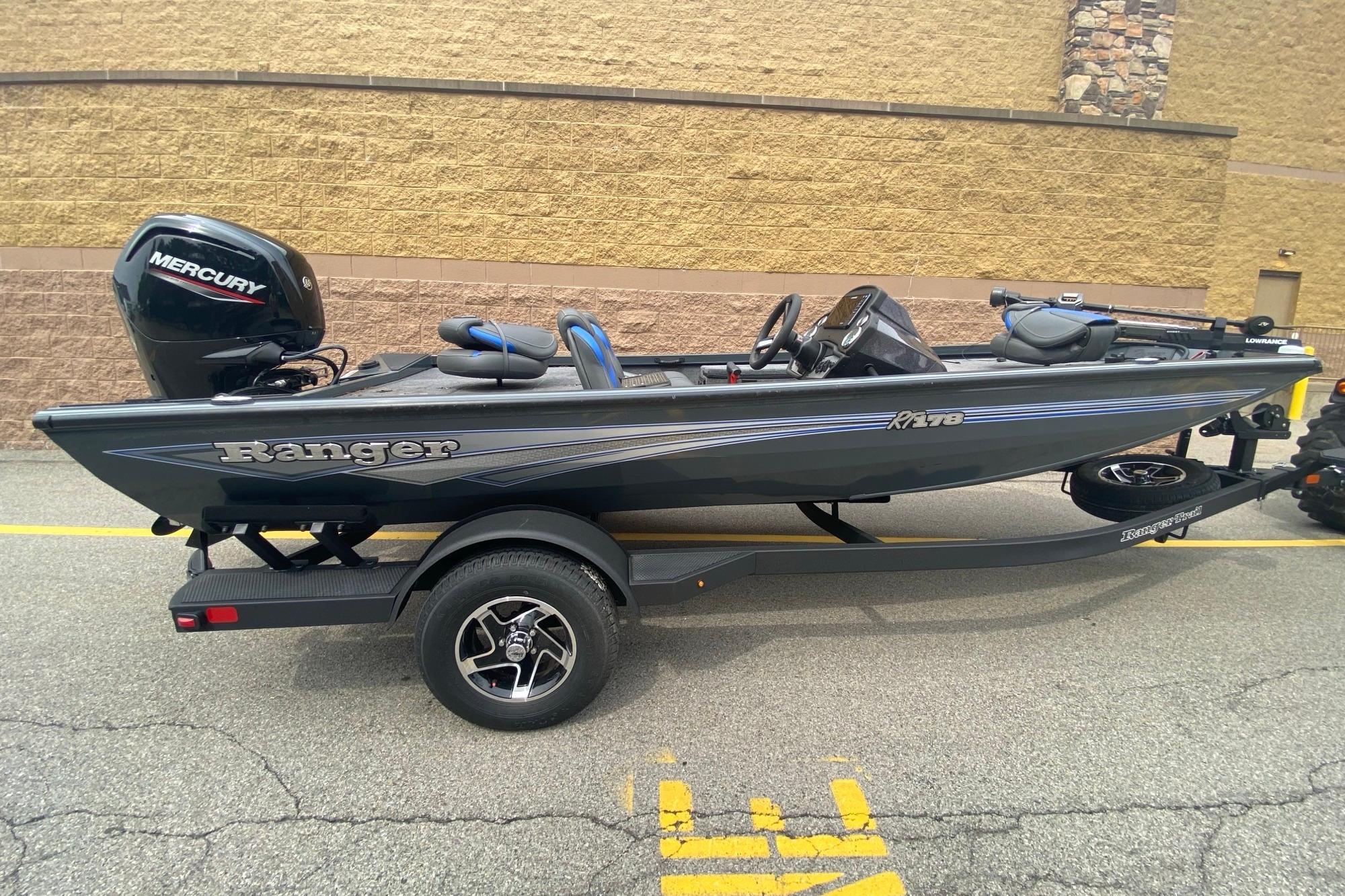2026 Ranger RT178 boat with Mercury engine on trailer, parked outdoors.