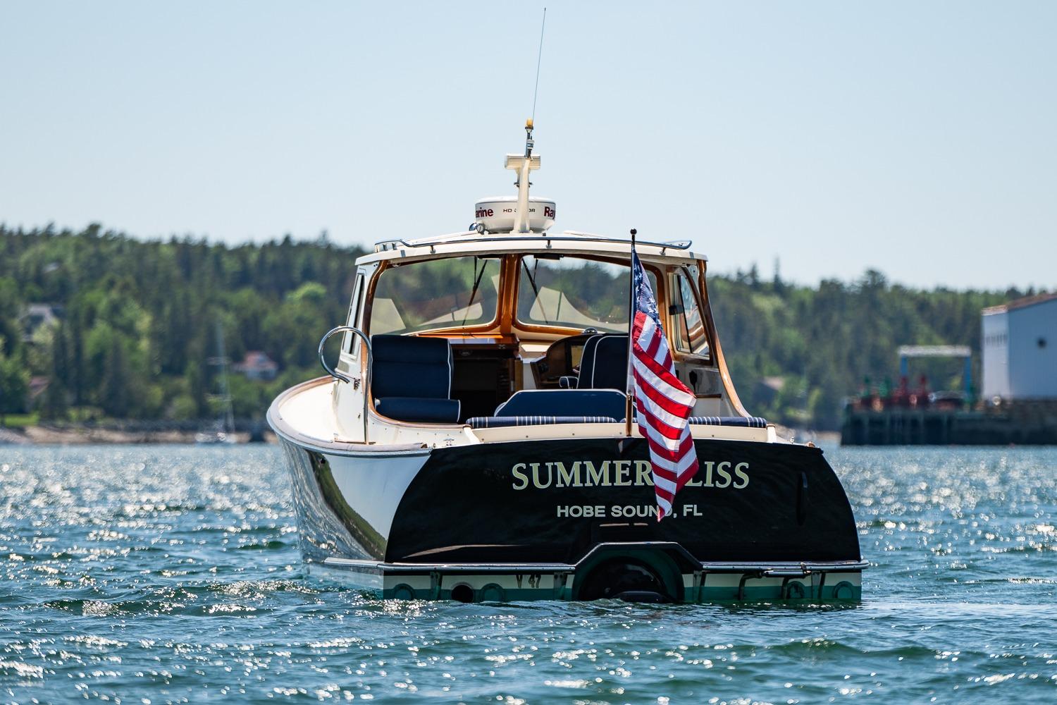 Hinckley Picnic Boat 36 Classic, 2001, named "Summer Bliss" on water, American flag displayed.
