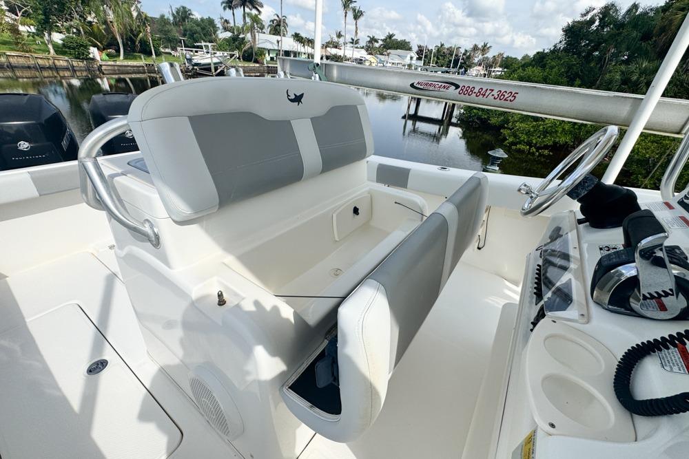 2018 Mako 284 Center Console boat interior with steering wheel and seating.