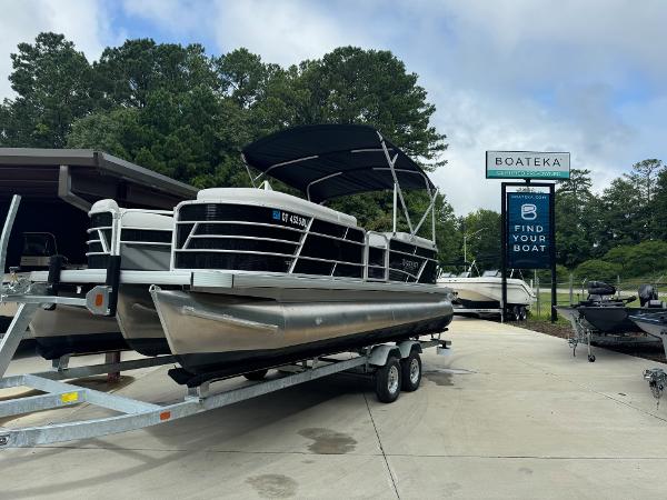 2023 Godfrey 2286 pontoon boat on a trailer at Boateka dealership.