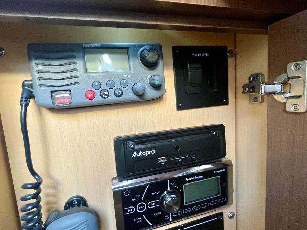 Control panel inside 2014 Sea Ray 330 Sundancer boat, featuring radio and electronic equipment.