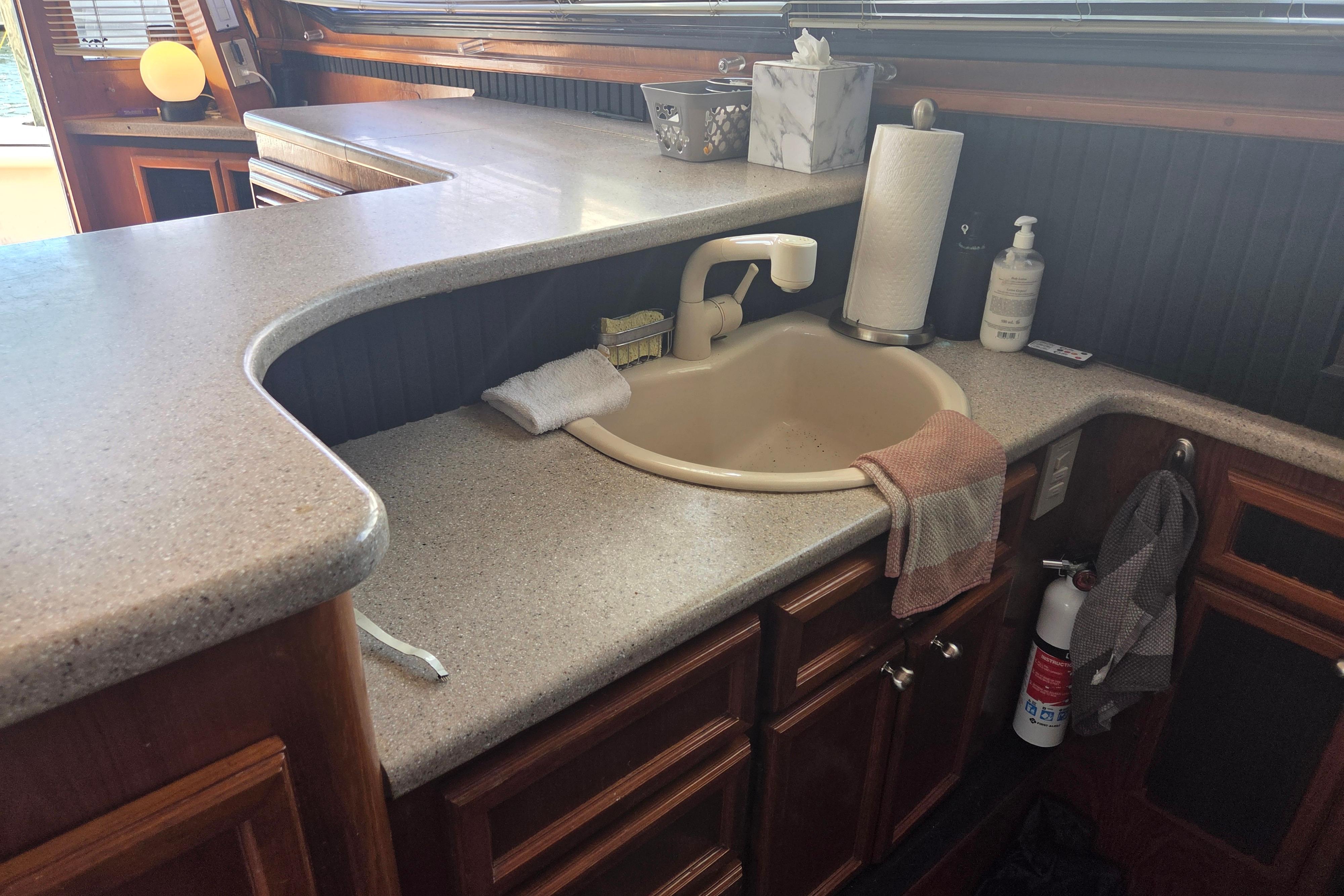 Interior of 1990 Egg Harbor Golden Egg 42 yacht with kitchen sink and countertop.