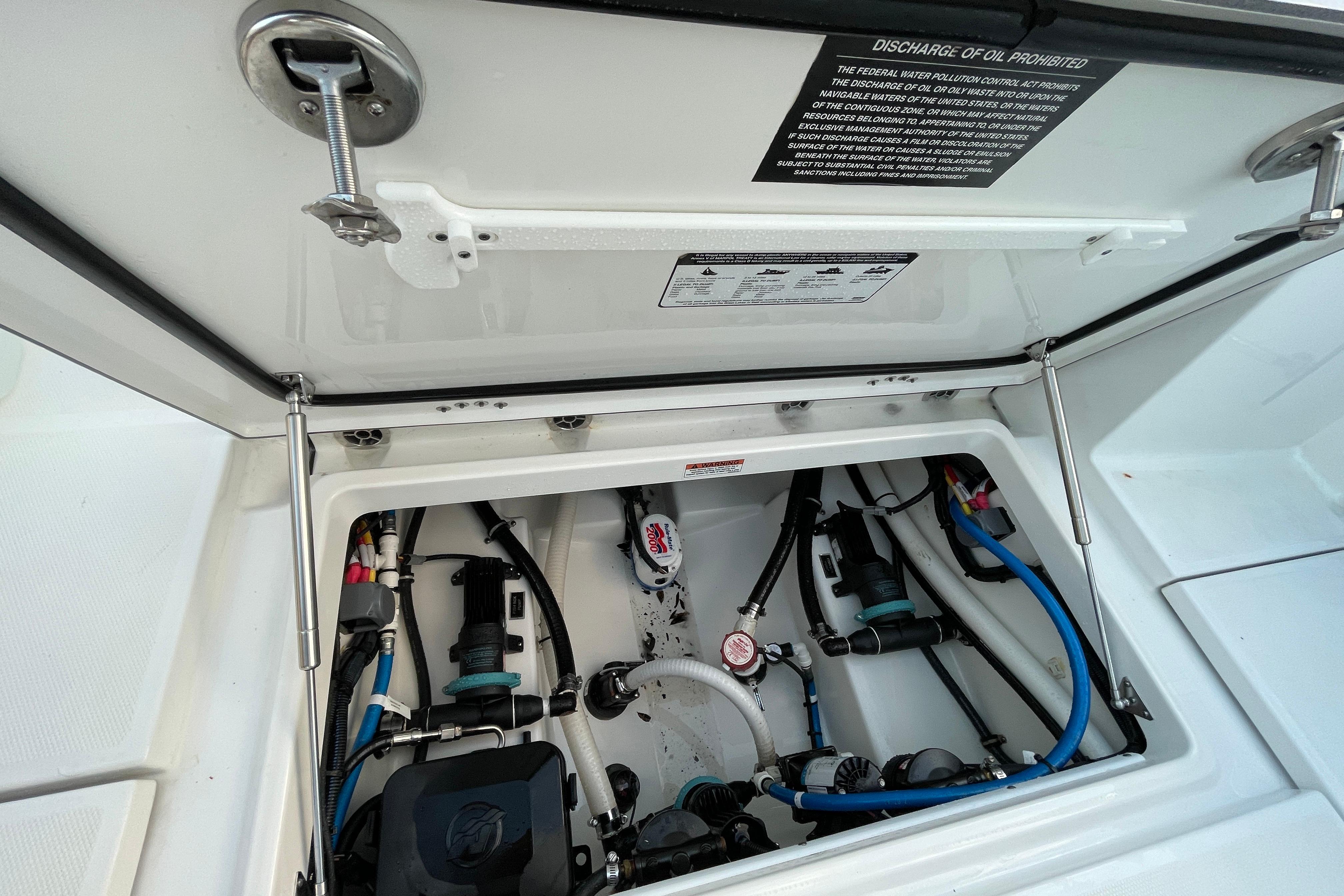 2022 Blackfin 252 CC boat compartment with visible wiring and components.