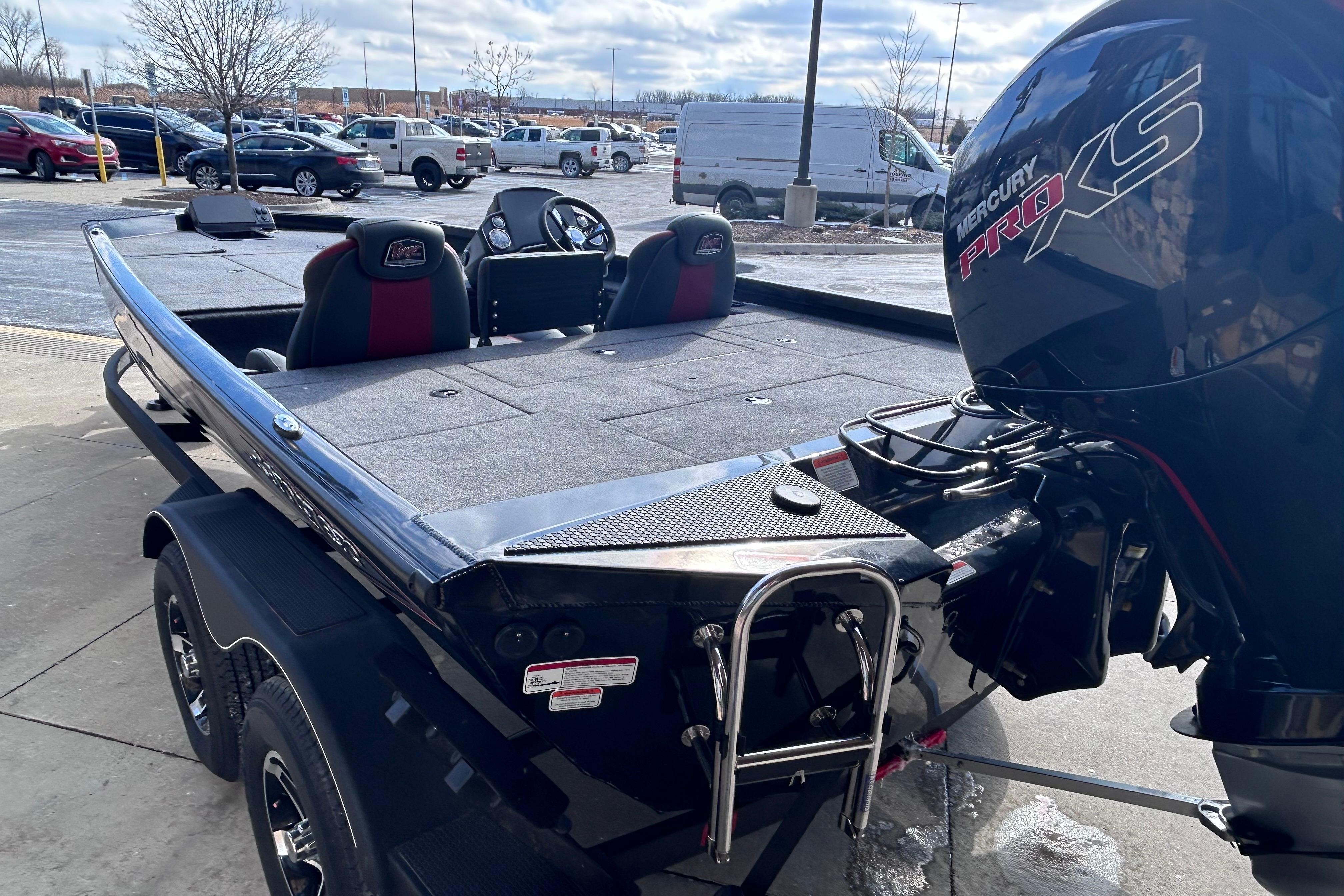 2025 Ranger RT198P boat with Mercury Pro XS engine in parking lot.