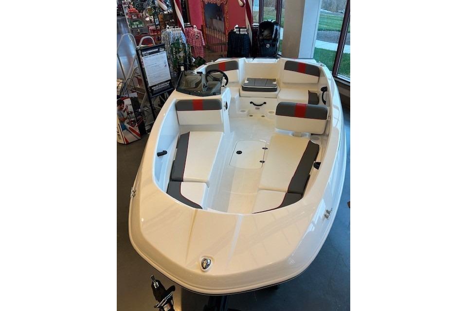 2026 Tahoe T16 boat with sleek white design and comfortable seating in showroom.