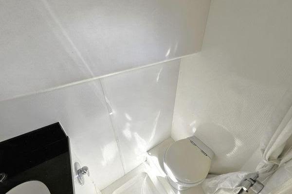 Bathroom interior of 2005 Sunseeker Manhattan 66 yacht, featuring modern fixtures and sleek design.