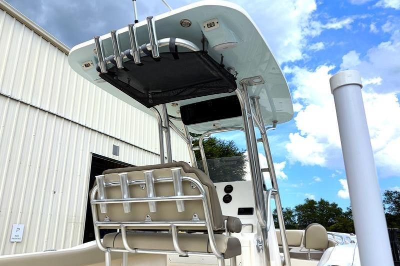 2024 Key West 239 FS boat with T-top and rod holders, parked outdoors.