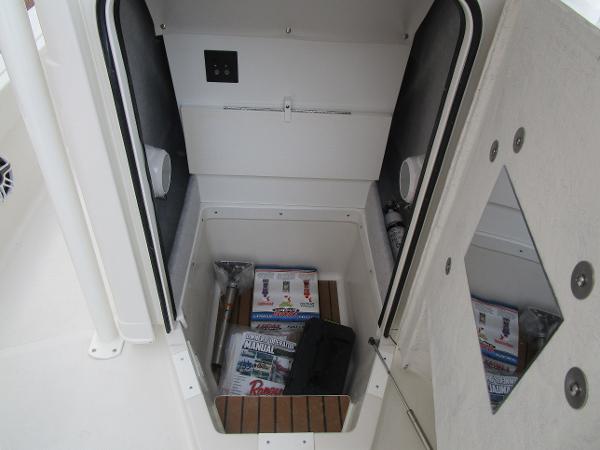2024 Ranger 2360 Bay boat storage compartment with equipment and manuals.