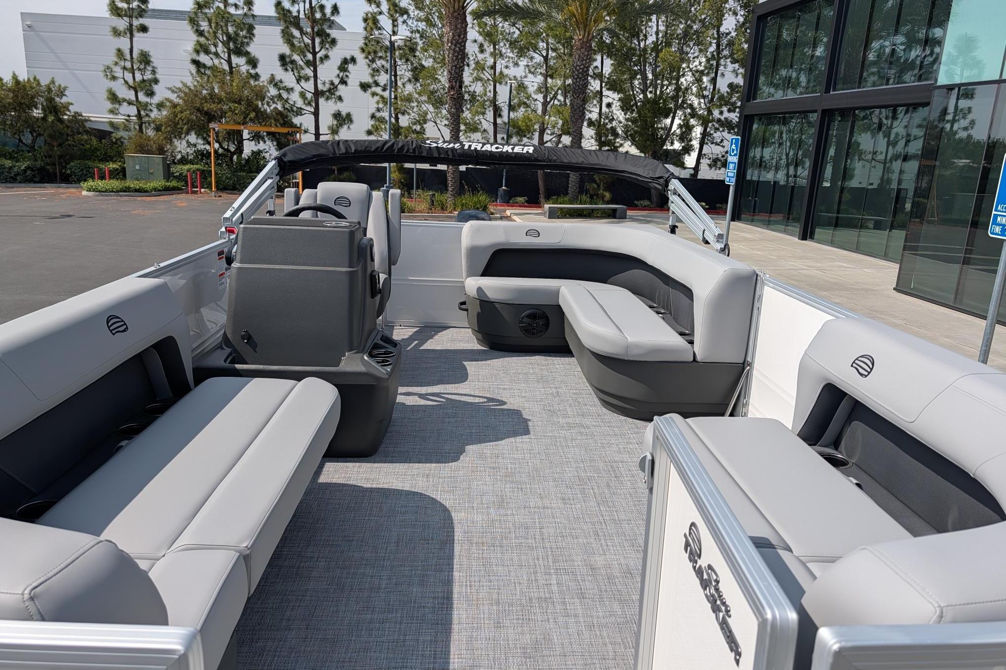 2026 Sun Tracker Party Barge 16 DLX interior with gray seating and modern design.