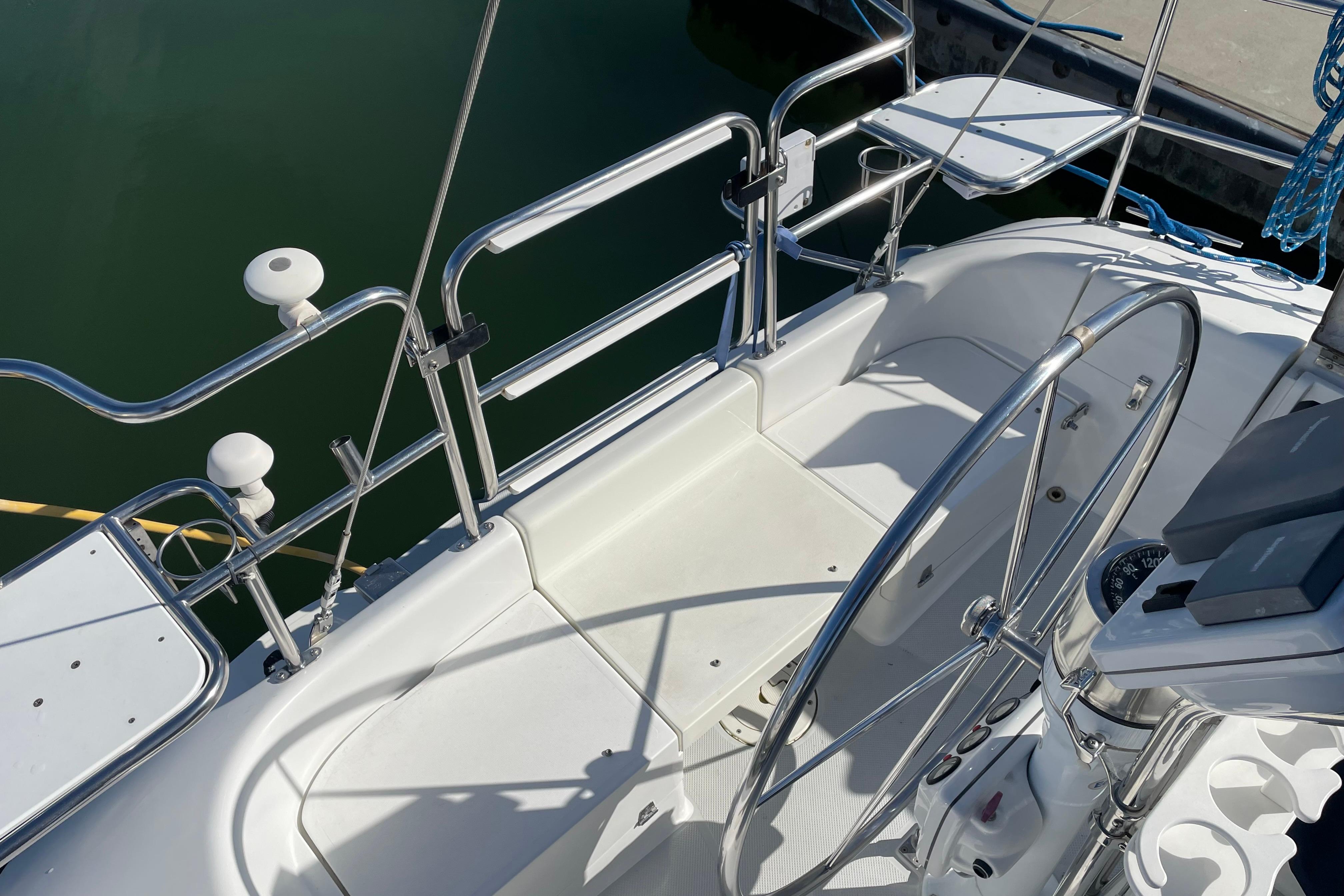 Cockpit of 2004 Catalina 36 MkII sailboat with steering wheel and seating area.