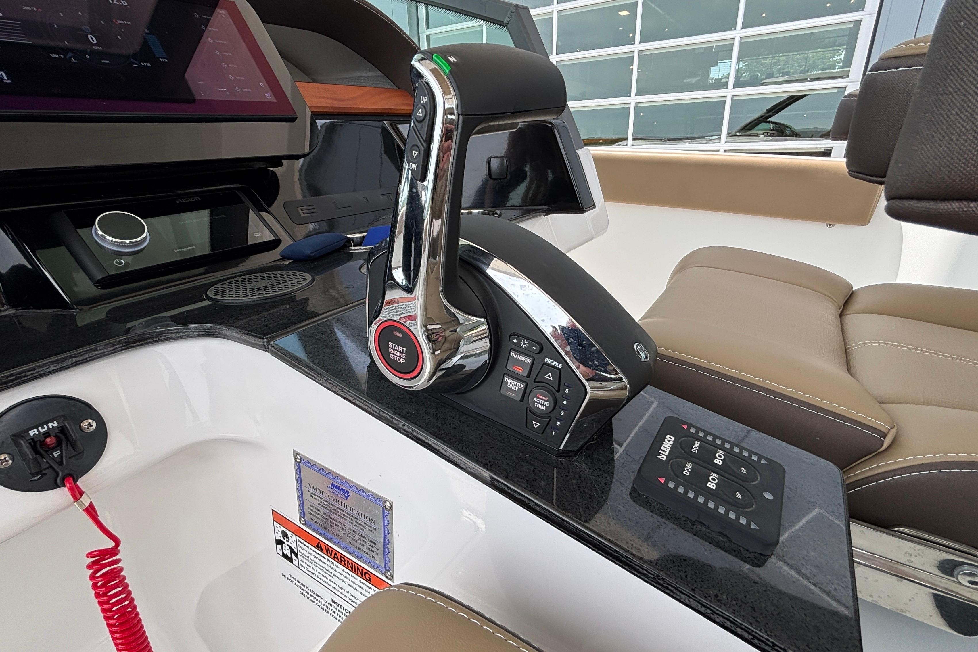 Control panel of a 2026 Monterey Elite 27 OB boat with modern features.