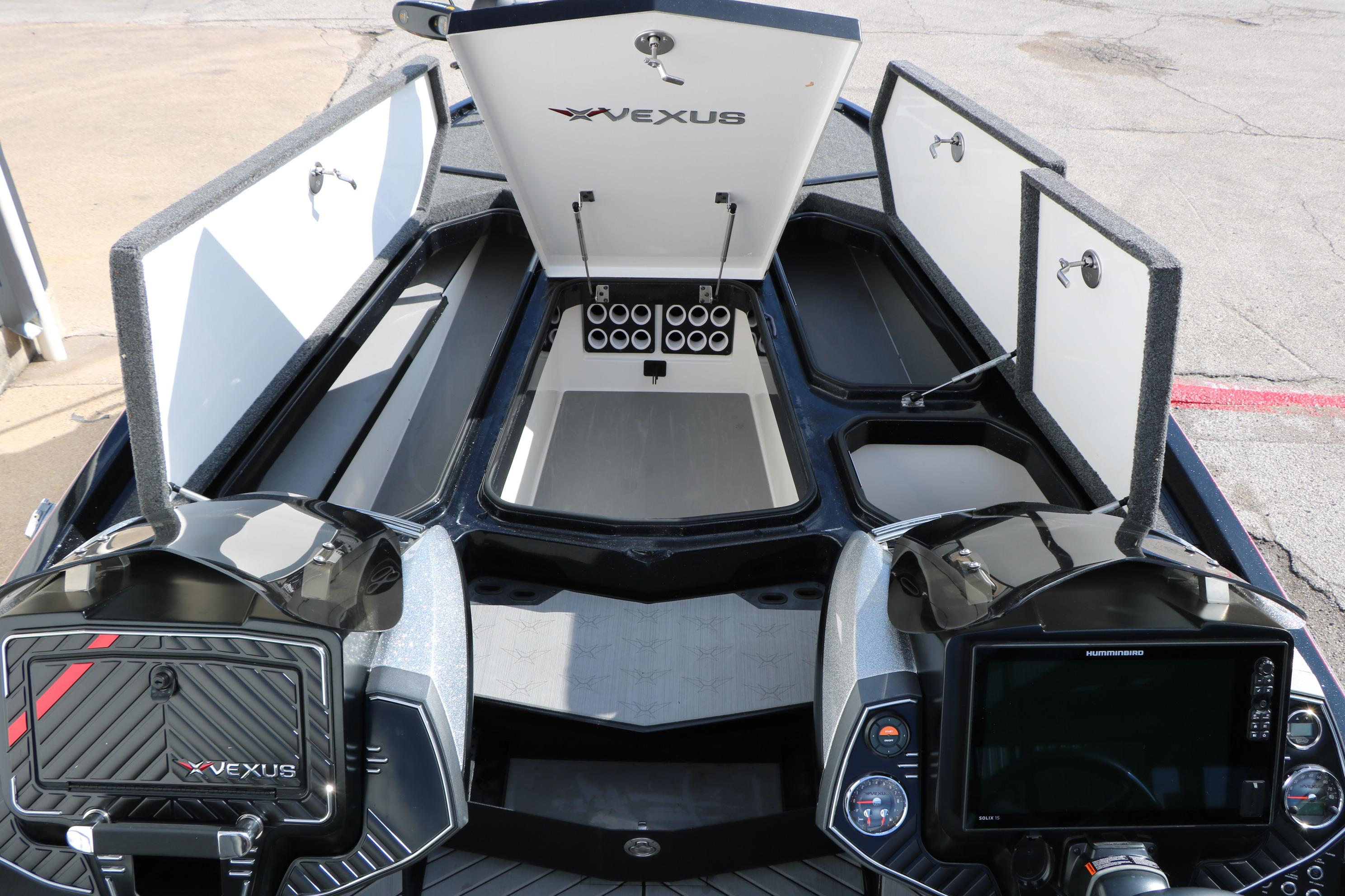 2022 Vexus VX21 boat interior with open storage compartments and advanced control panel.