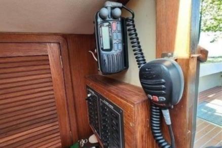 1985 Wasque Down East Cruiser interior with radio and control panel.