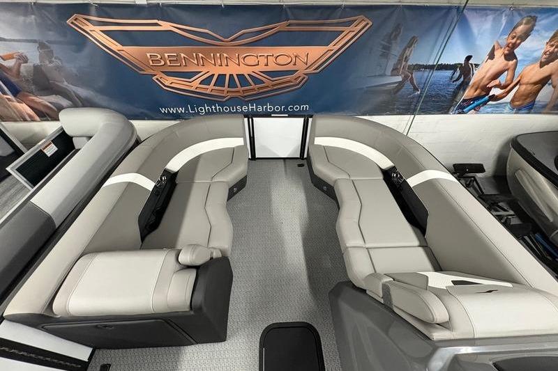 Luxurious Evotti 523QL boat interior with plush seating, showcased at Bennington display.
