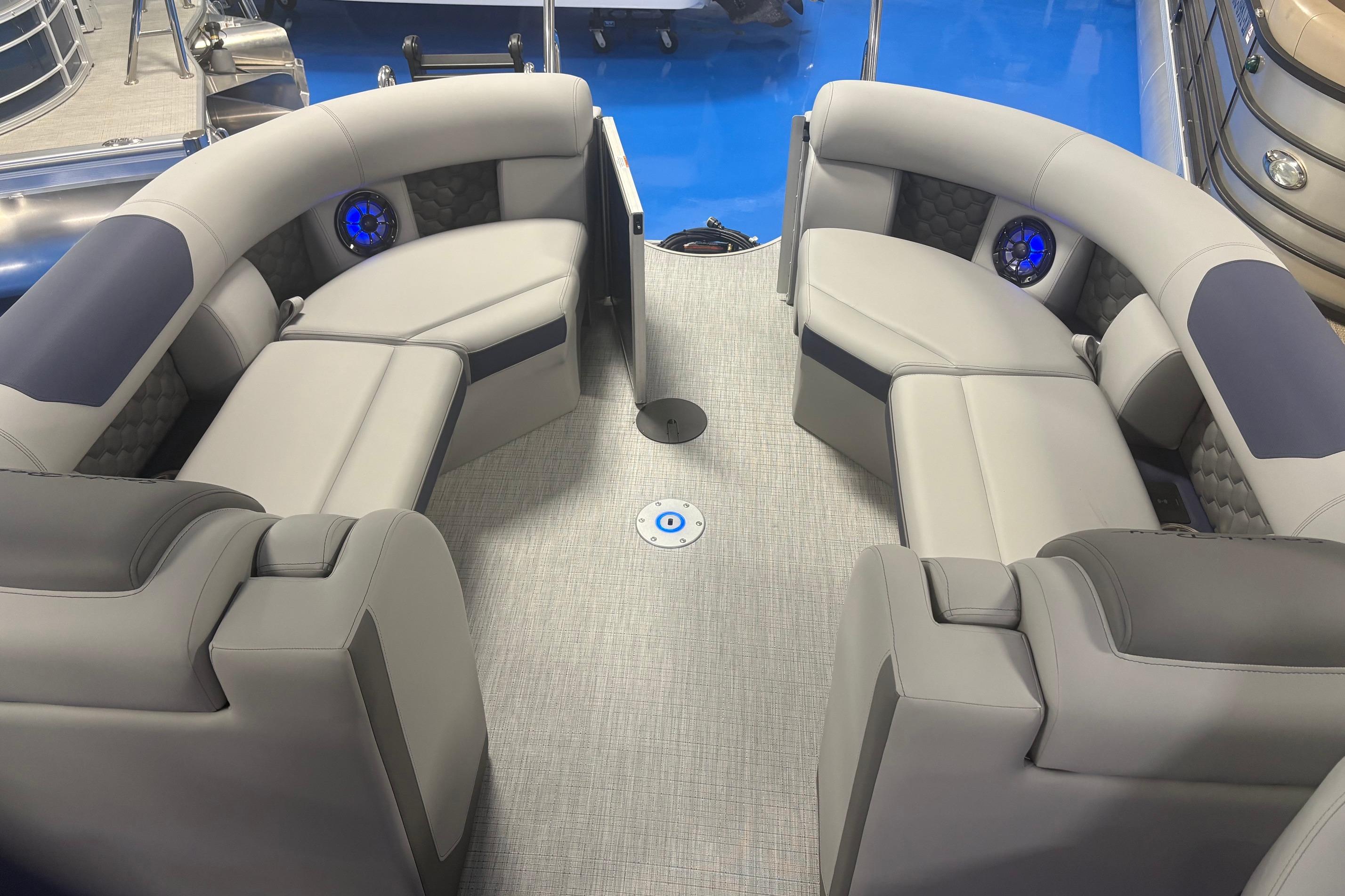 Luxurious seating area on 2026 South Bay 523RS pontoon boat with modern design and blue accents.