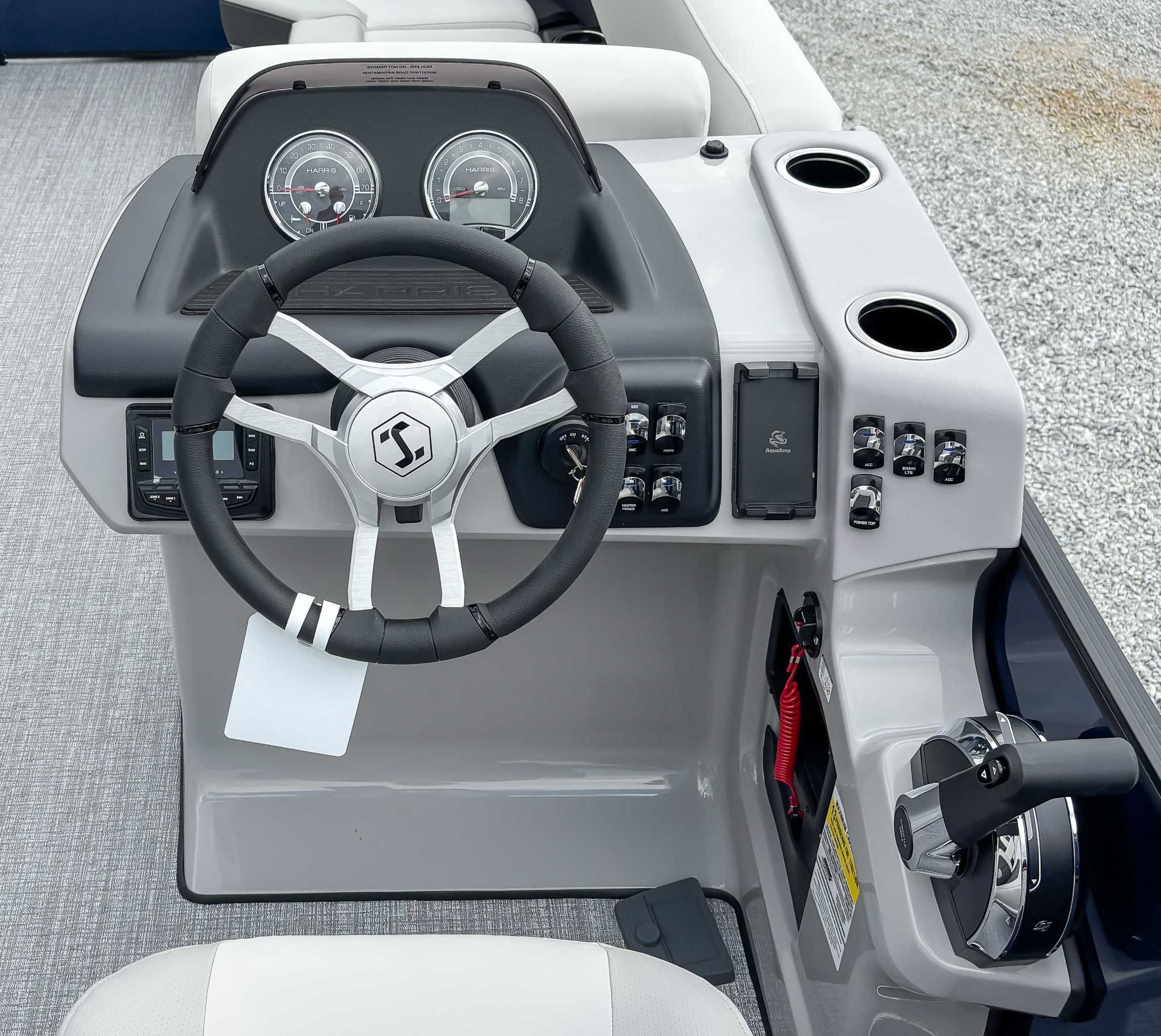 2026 Harris Cruiser 230 SLDH helm with modern controls and steering wheel.