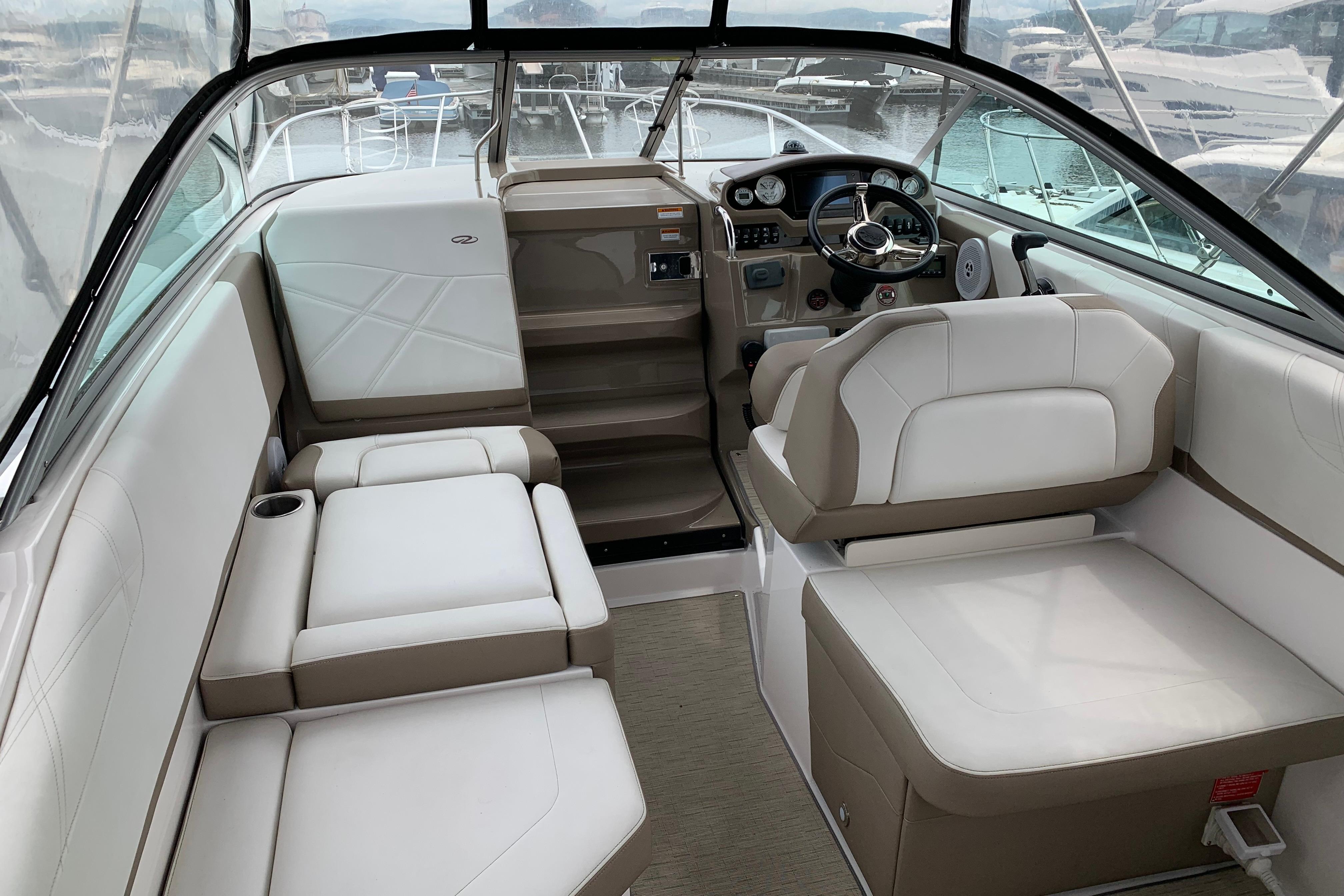 Interior of a 2017 Regal 26 Express boat with plush seating and modern dashboard.
