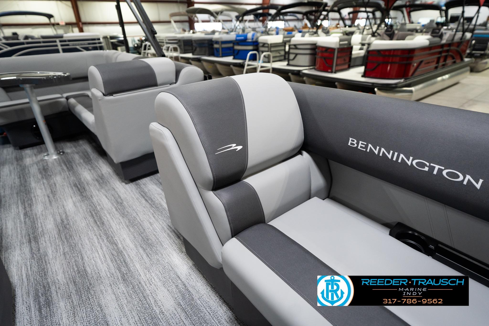2026 Bennington 188 SL boat interior with gray seating in showroom.