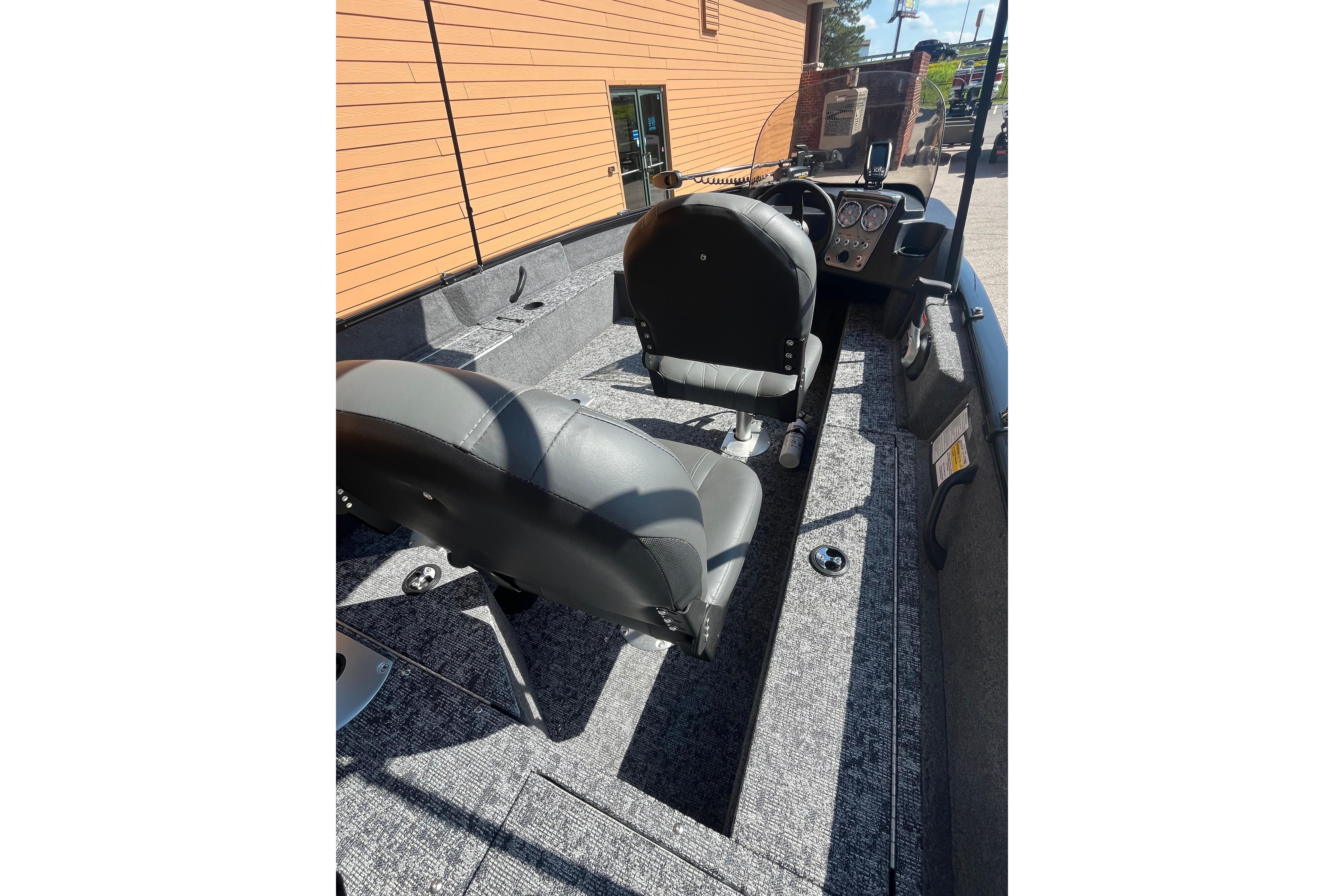 2026 Tracker Pro Guide V-16 SC boat interior with seating and control panel.