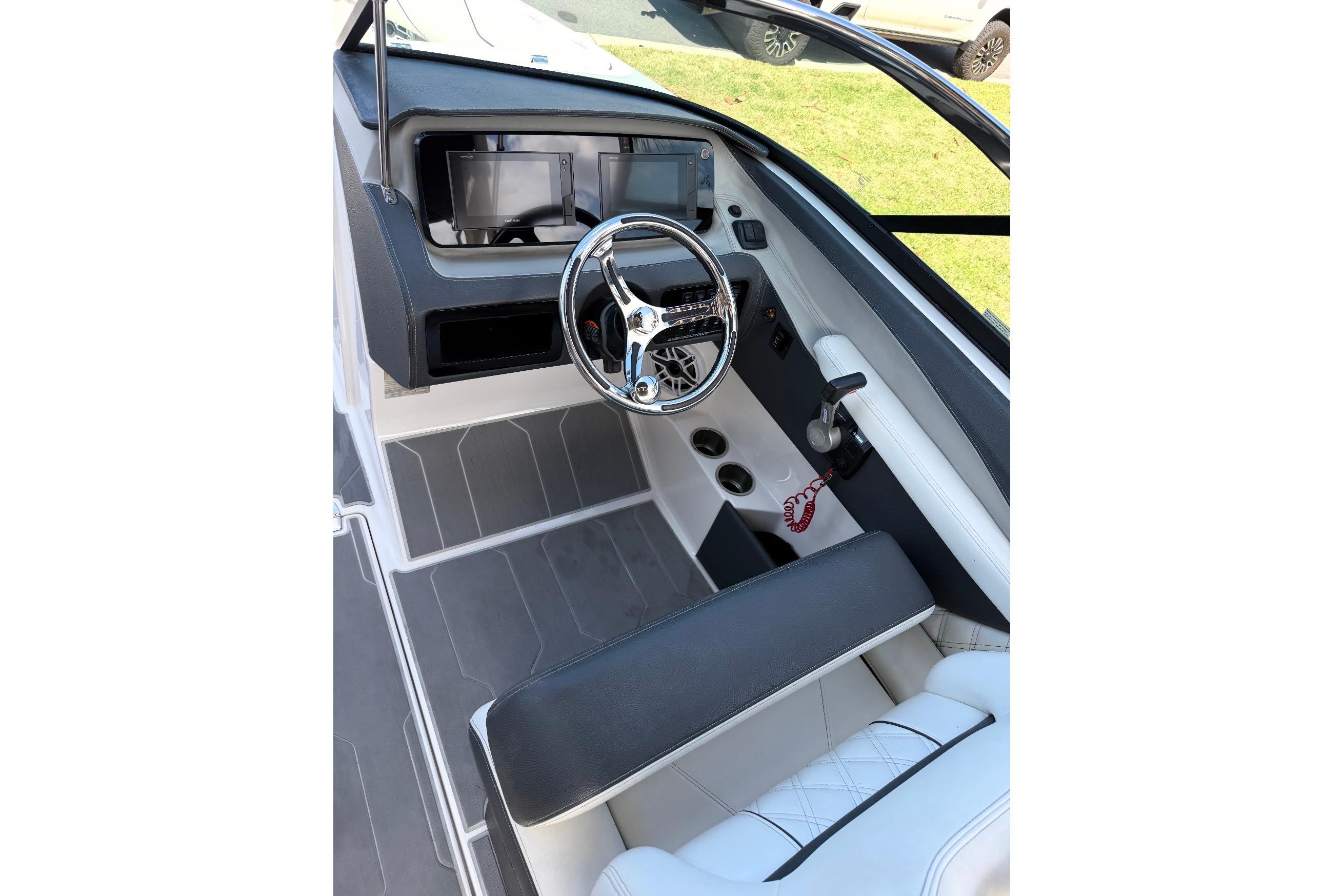 2020 Regal LX4 boat cockpit with modern steering and dashboard controls.