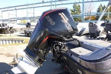 2026 Ranger 2080MS boat with powerful outboard motor in marina setting.