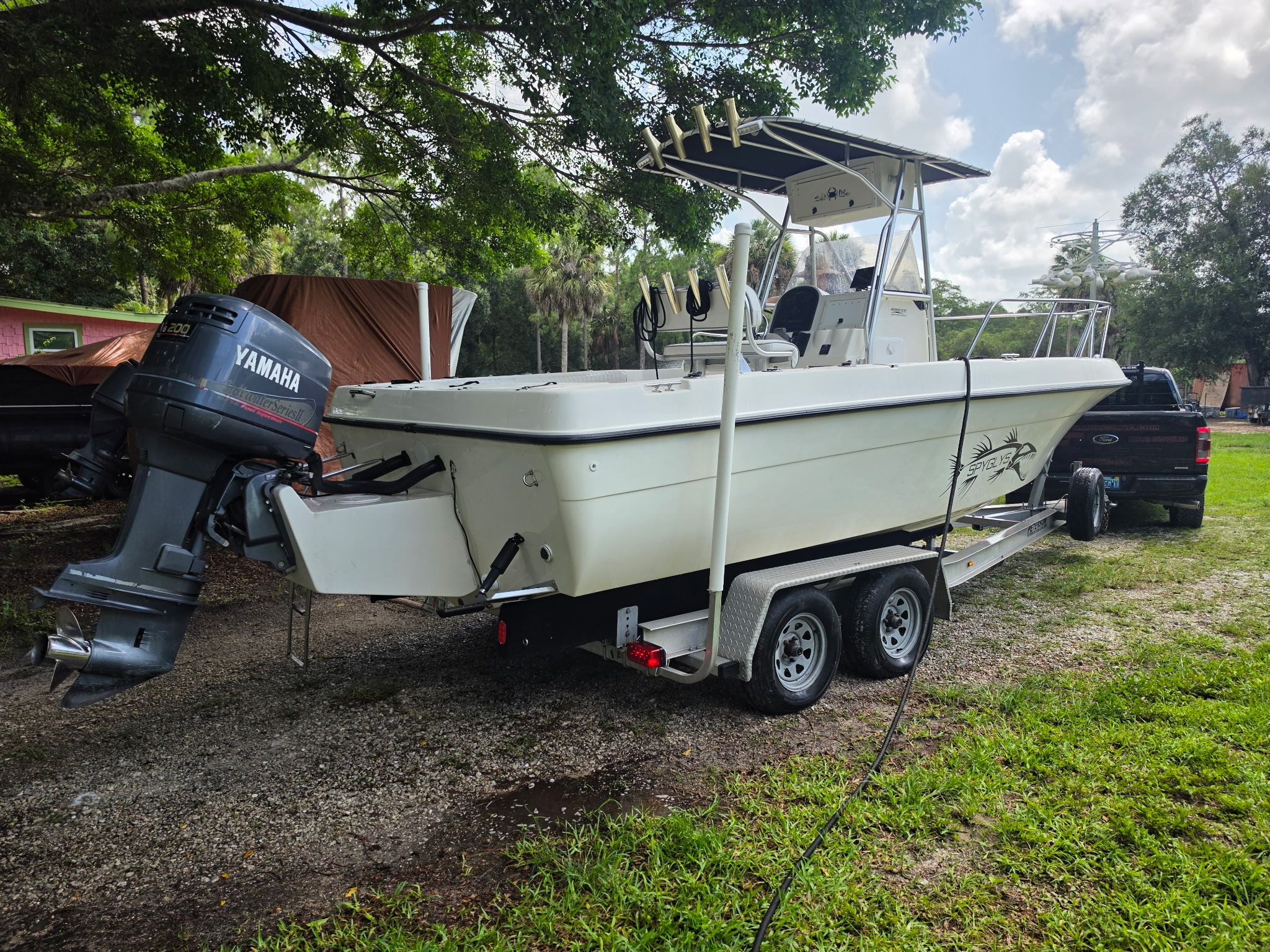 A 2004 Hydra-Sports Lightning 230 CC on a trailer, featuring a Yamaha outboard motor.