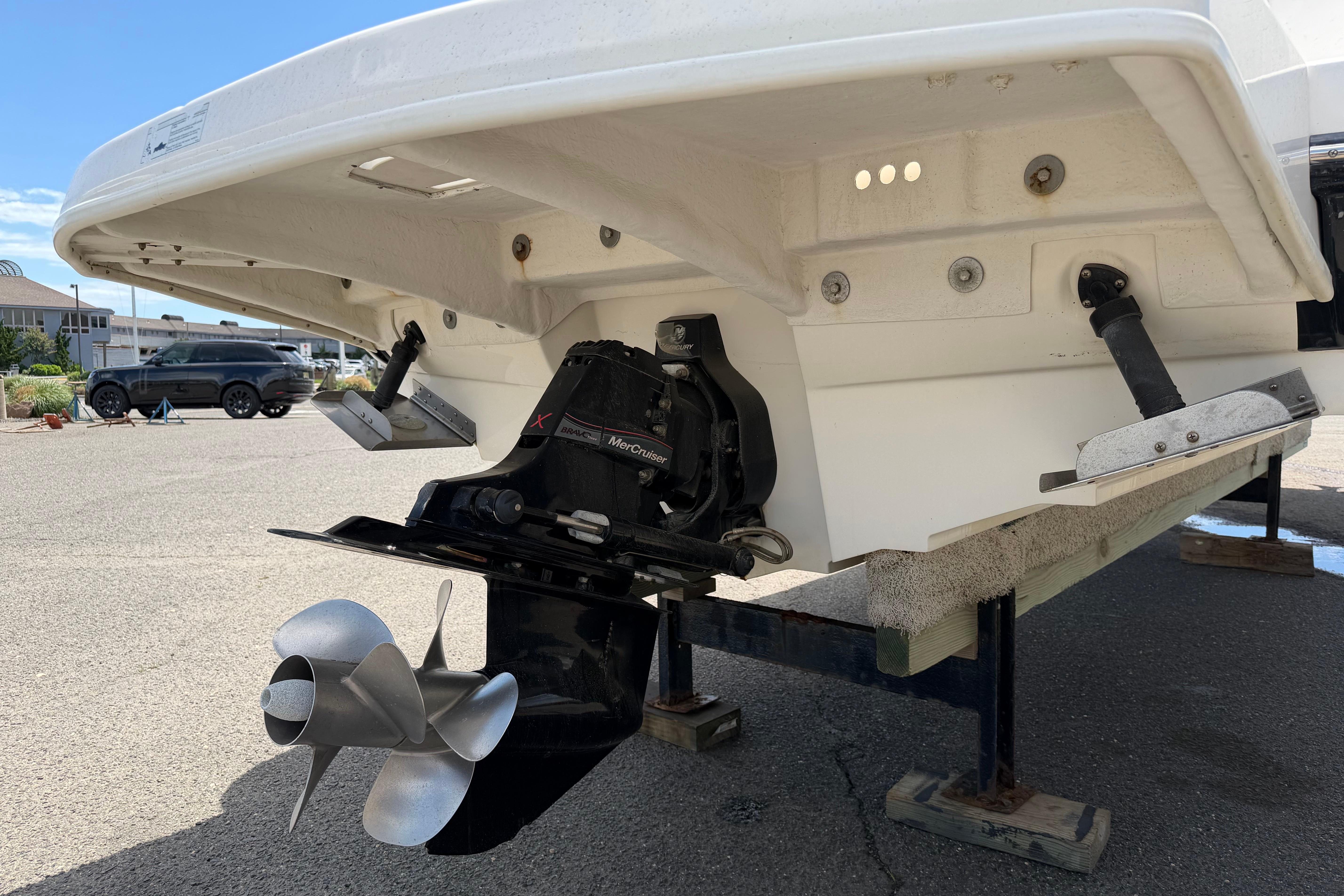 Rear view of 2013 Sea Ray 300 Sundeck boat with MerCruiser engine.