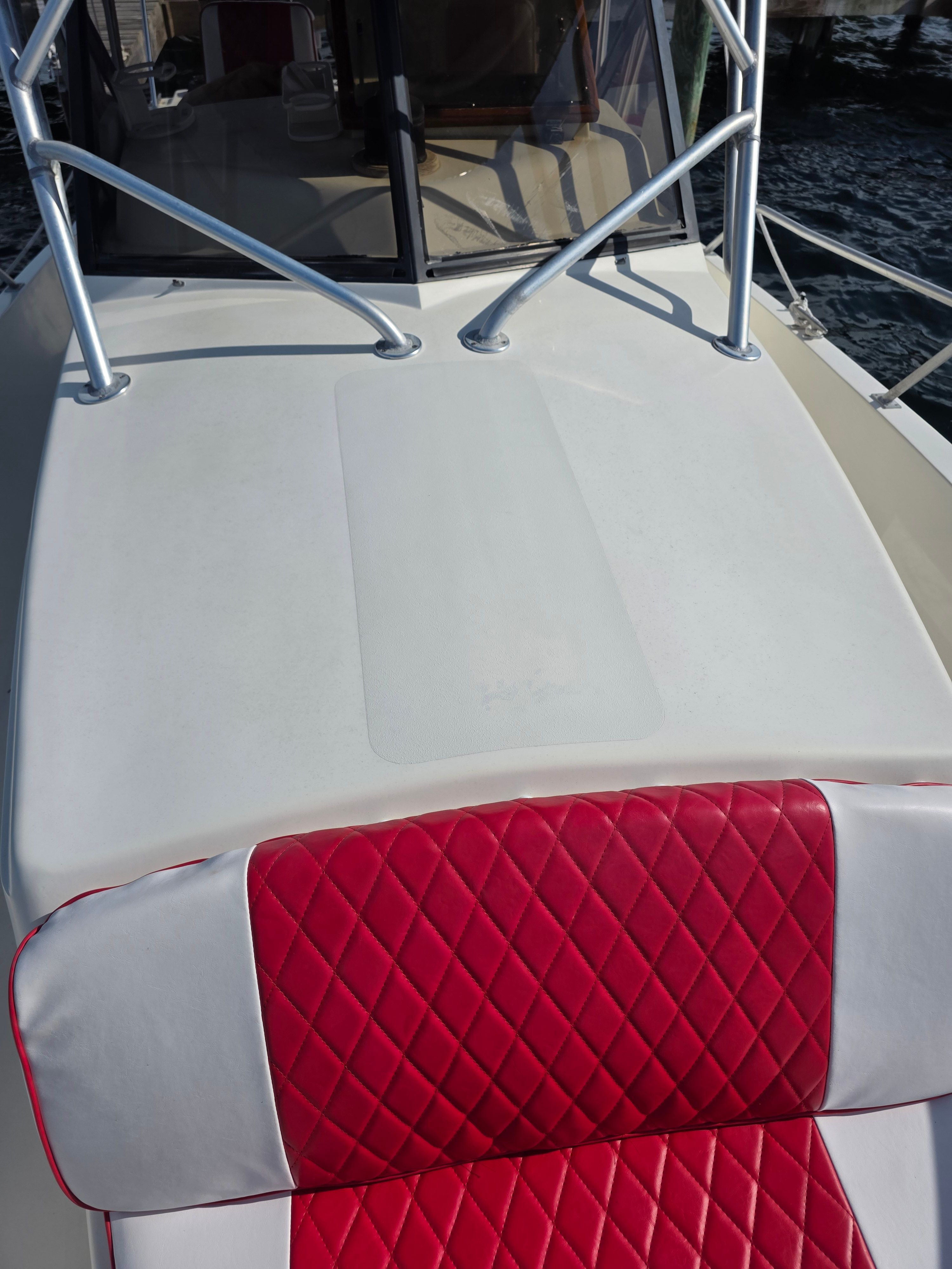 1987 Mako 248 WAC boat with red seat upholstery.
