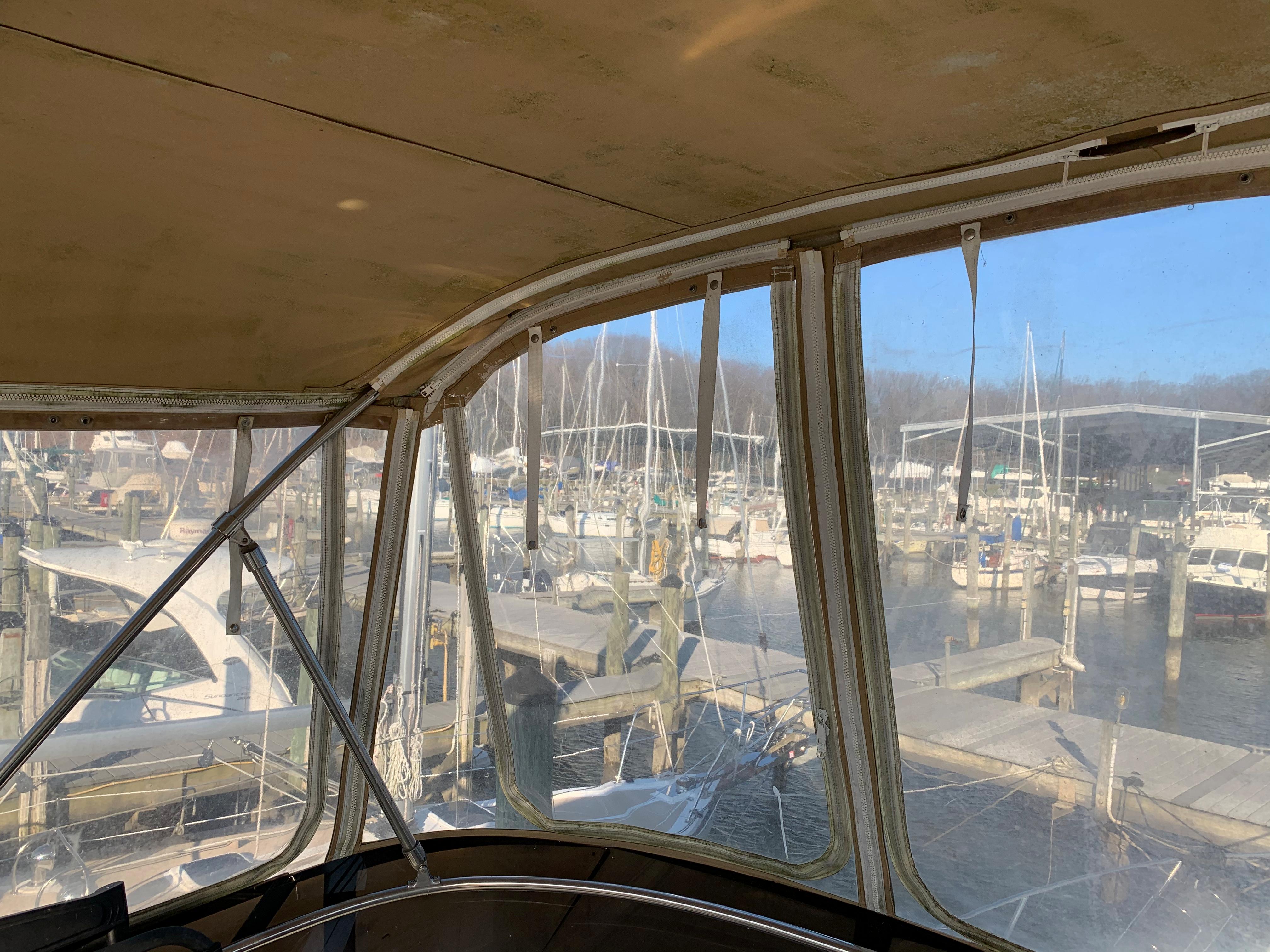 1992 Silverton 34 Aft Cabin Motor Yacht docked at a marina, view from inside.