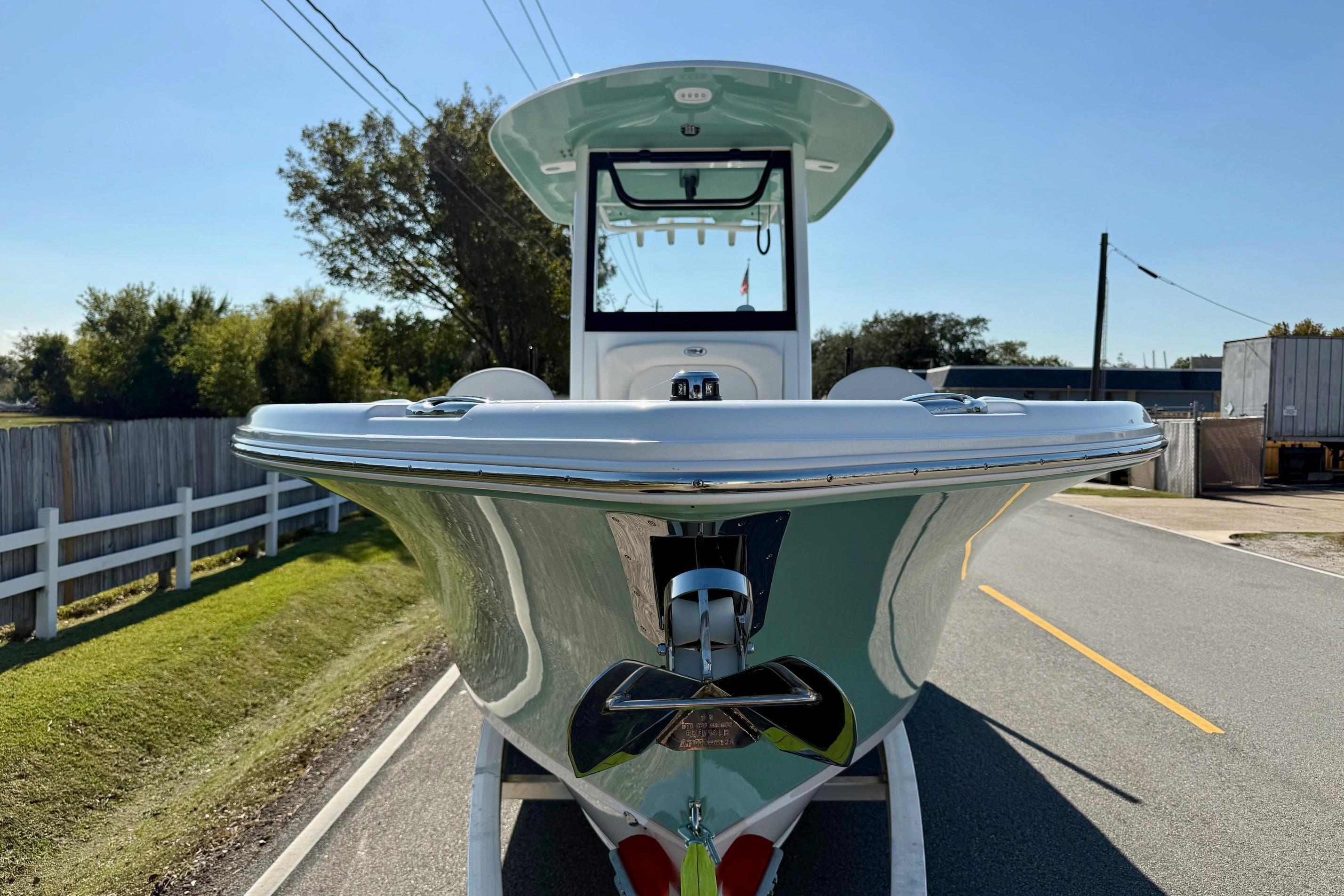 2026 Sea Hunt Ultra 255 SE boat on trailer, front view, sunny day.