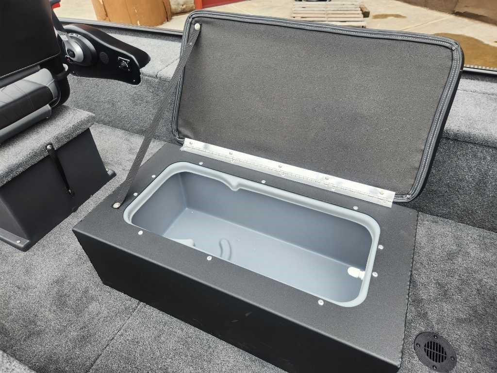 2025 Tracker Panfish 17 boat with open storage compartment, gray interior.