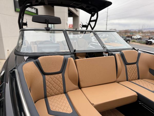 2025 Yamaha Boats 255XD interior with tan and black seating, modern design.