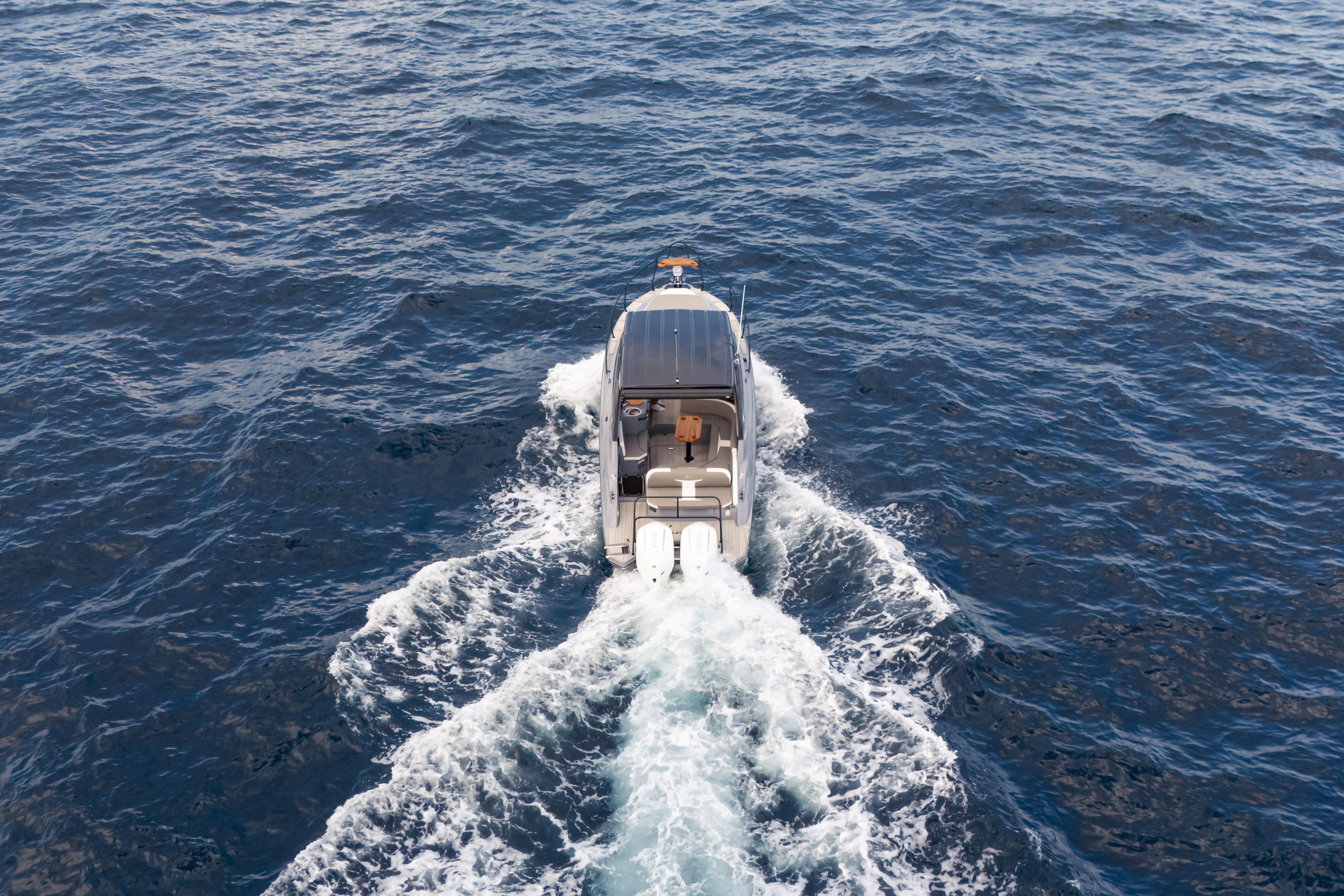 Aerial view of Hanover 305 boat cruising on open sea, 2026 model.