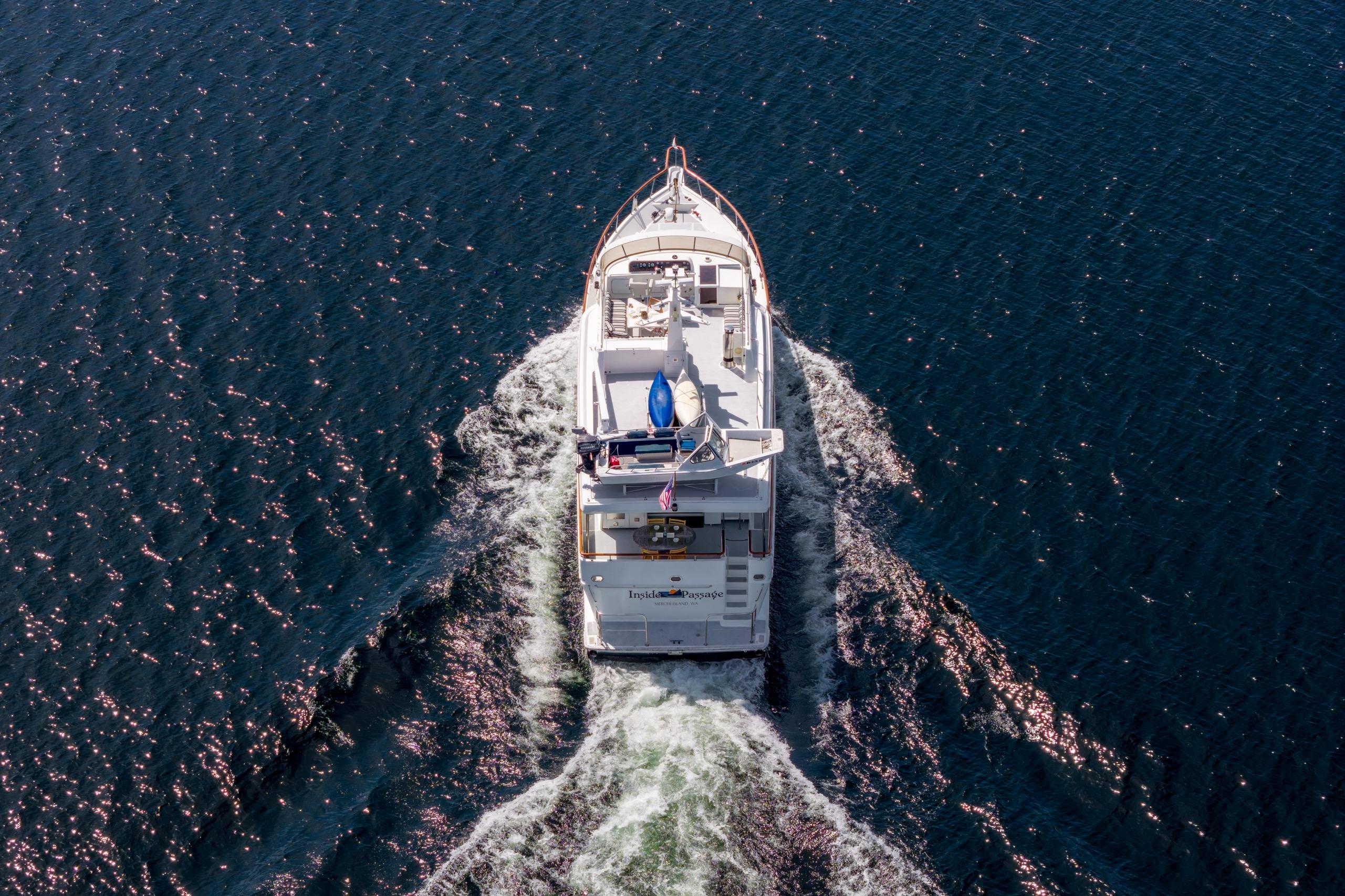Aerial view of 1991 Forbes Cooper Pilothouse Motoryacht cruising on open water.