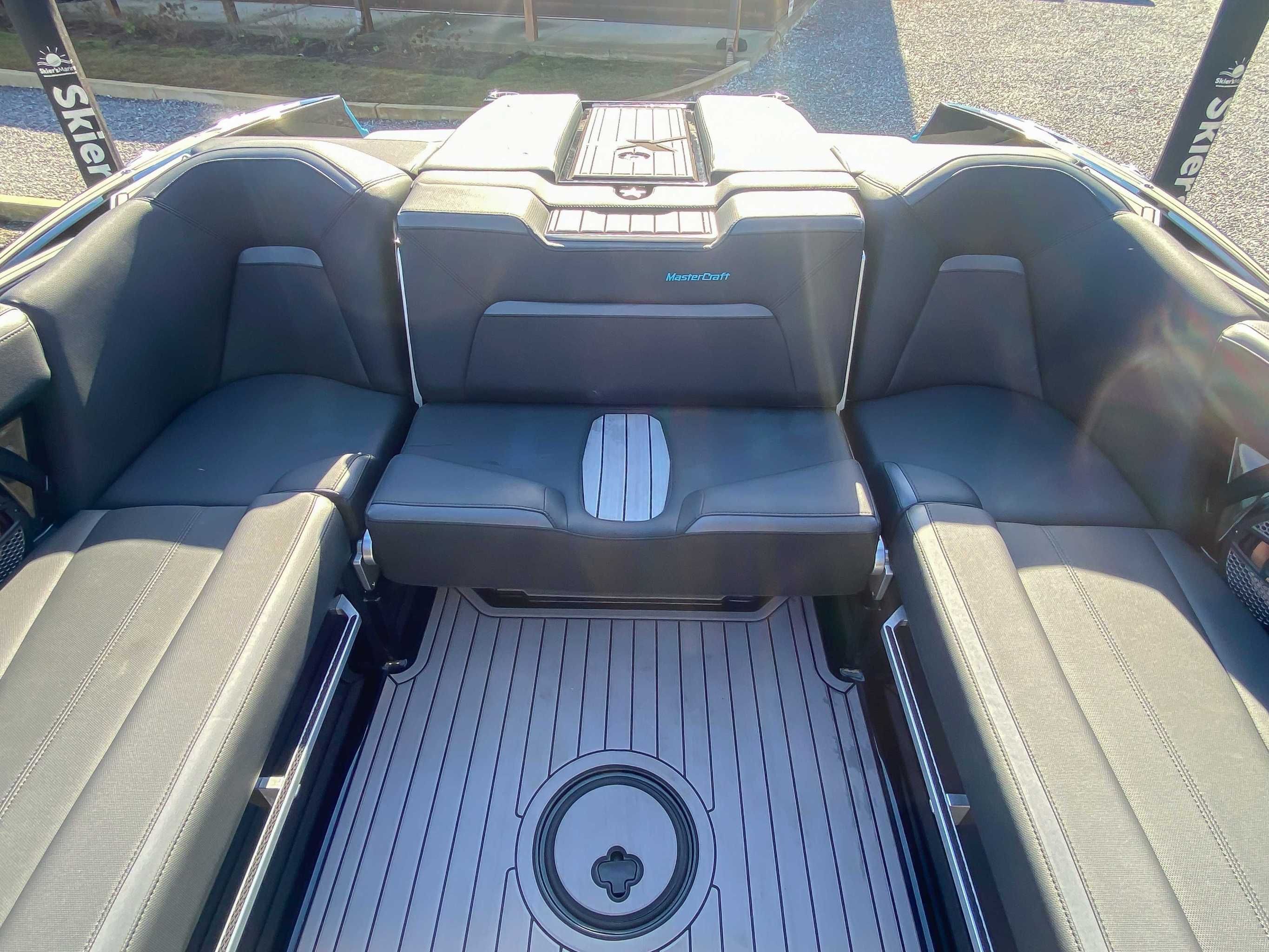 Interior of 2024 MasterCraft XStarS boat with gray seating.